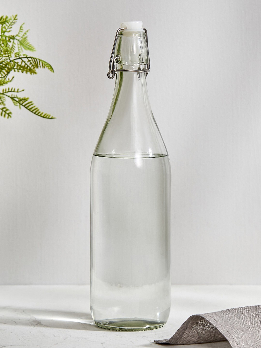 

Home Centre Infinity Ardour Transparent Glass Water Bottle with Stopper - 1L