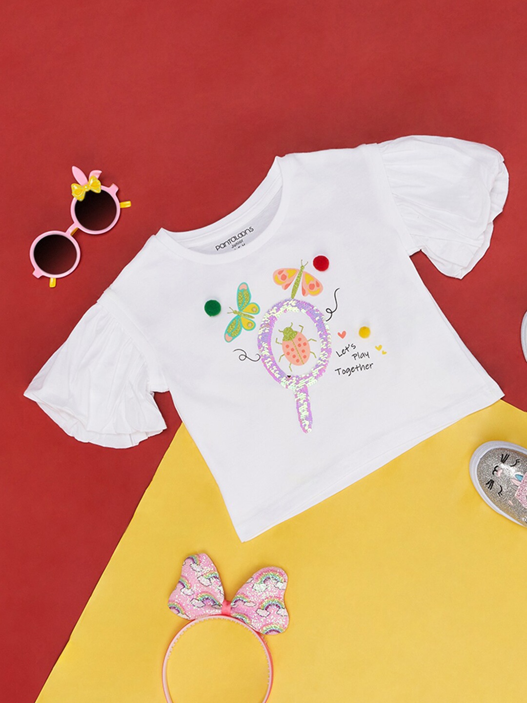 

Pantaloons Junior Girls Graphic Printed Flared Sleeves Cotton Top, White