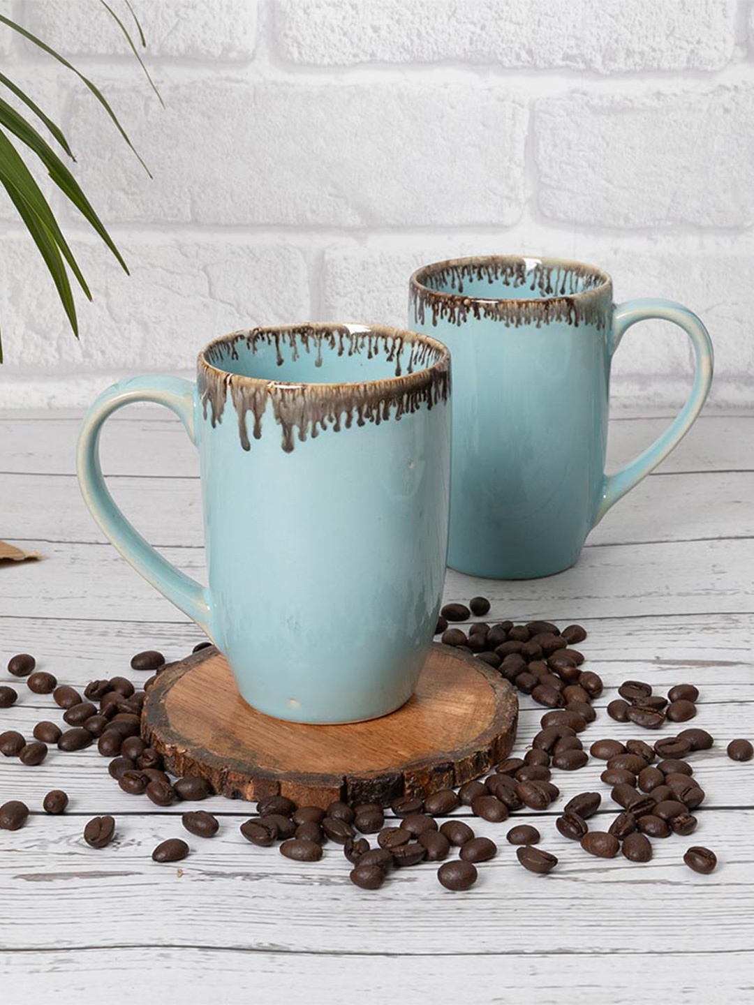 

Homesake Turquoise Blue & Brown 2 Pieces Printed Ceramic Glossy Mugs - 260 ml Each