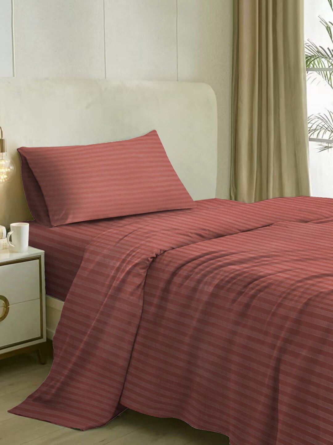 

Naksh Rust Striped 210 TC Cotton Single Bedsheet with 1 Pillow Cover