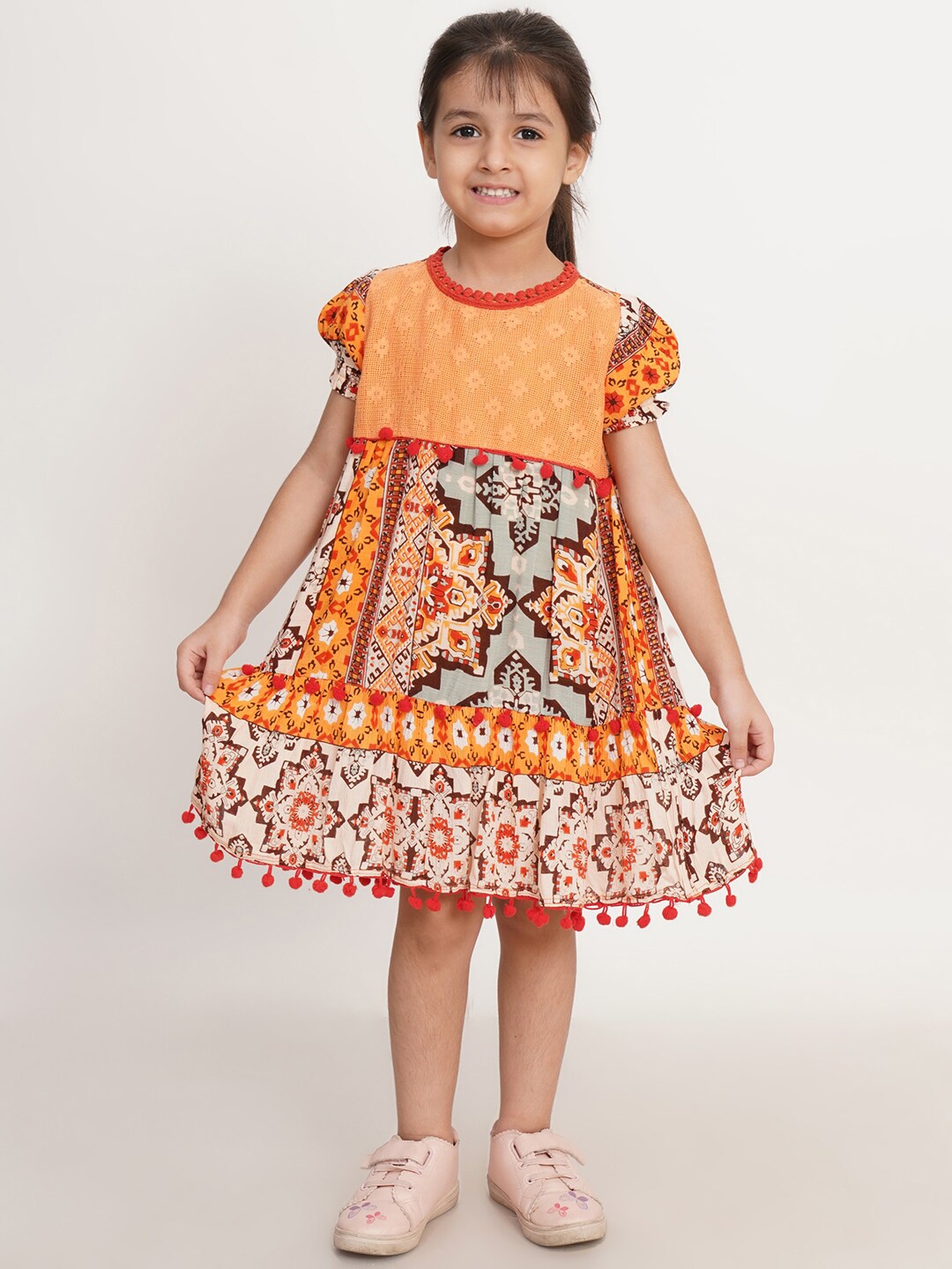 

Creative Kids Girls Ethnic Motifs Printed with Pom-Pom Detail Cotton A-Line Dress, Yellow