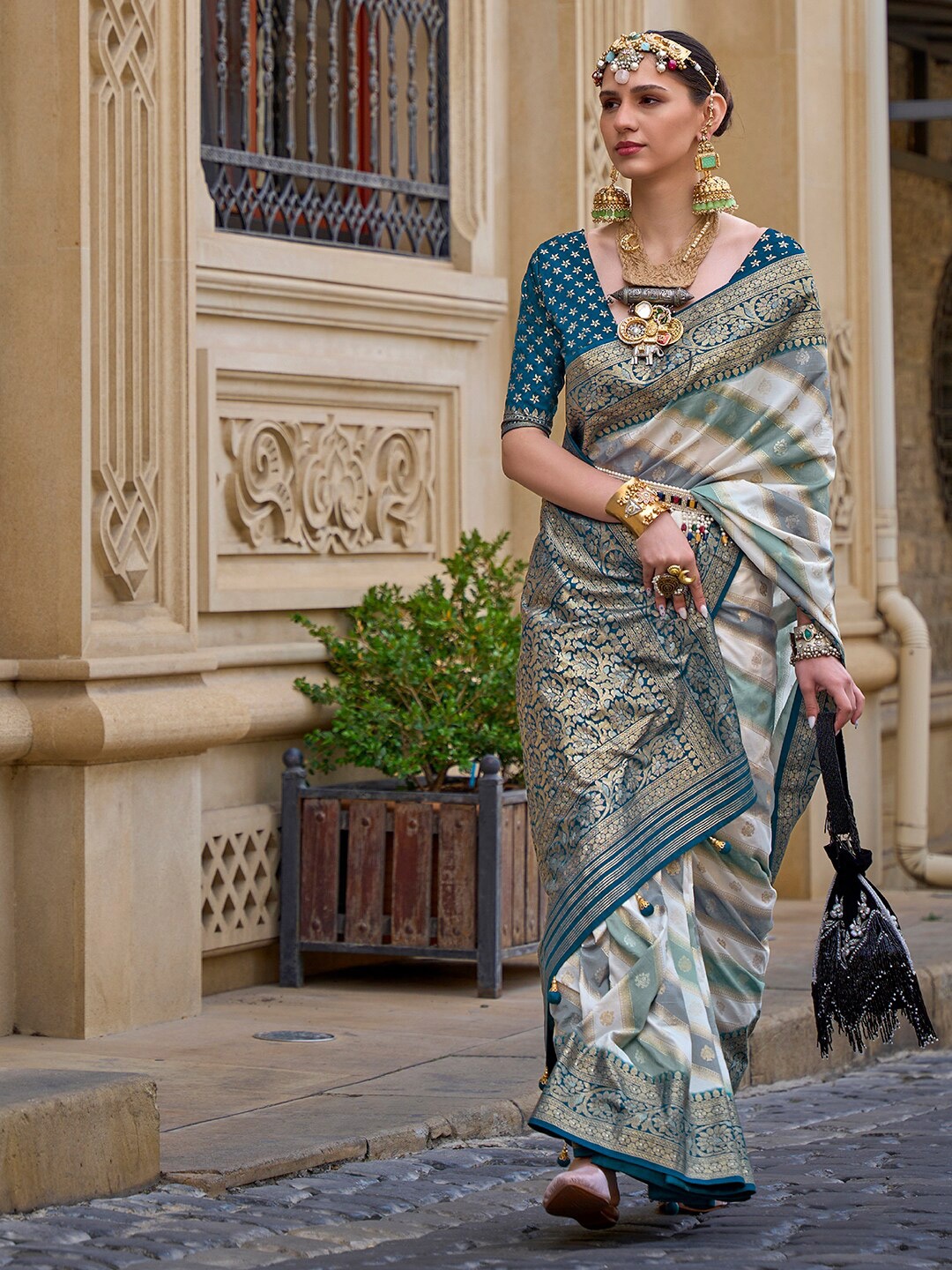 

Anouk Teal & Beige Ethnic Motifs Woven Design Zari Banarasi Saree