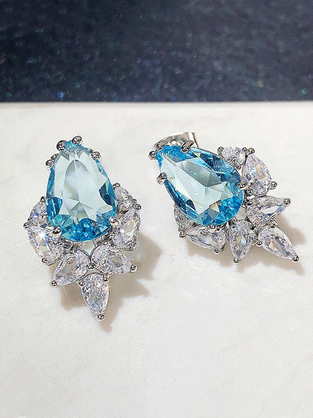 

Designs & You Silver Plated Teardrop Shaped Studs Earrings