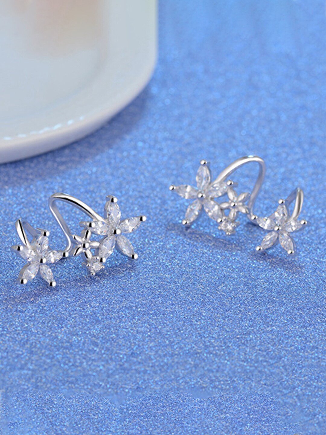 

Designs & You Silver Plated American Diamond Star Shaped Studs Earrings