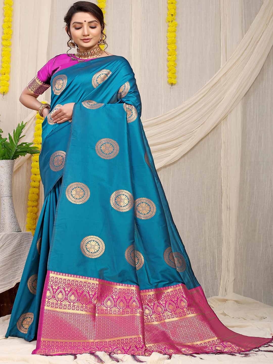 

Mitera Blue & Fuchsia Ethnic Motifs Woven Design Zari Saree