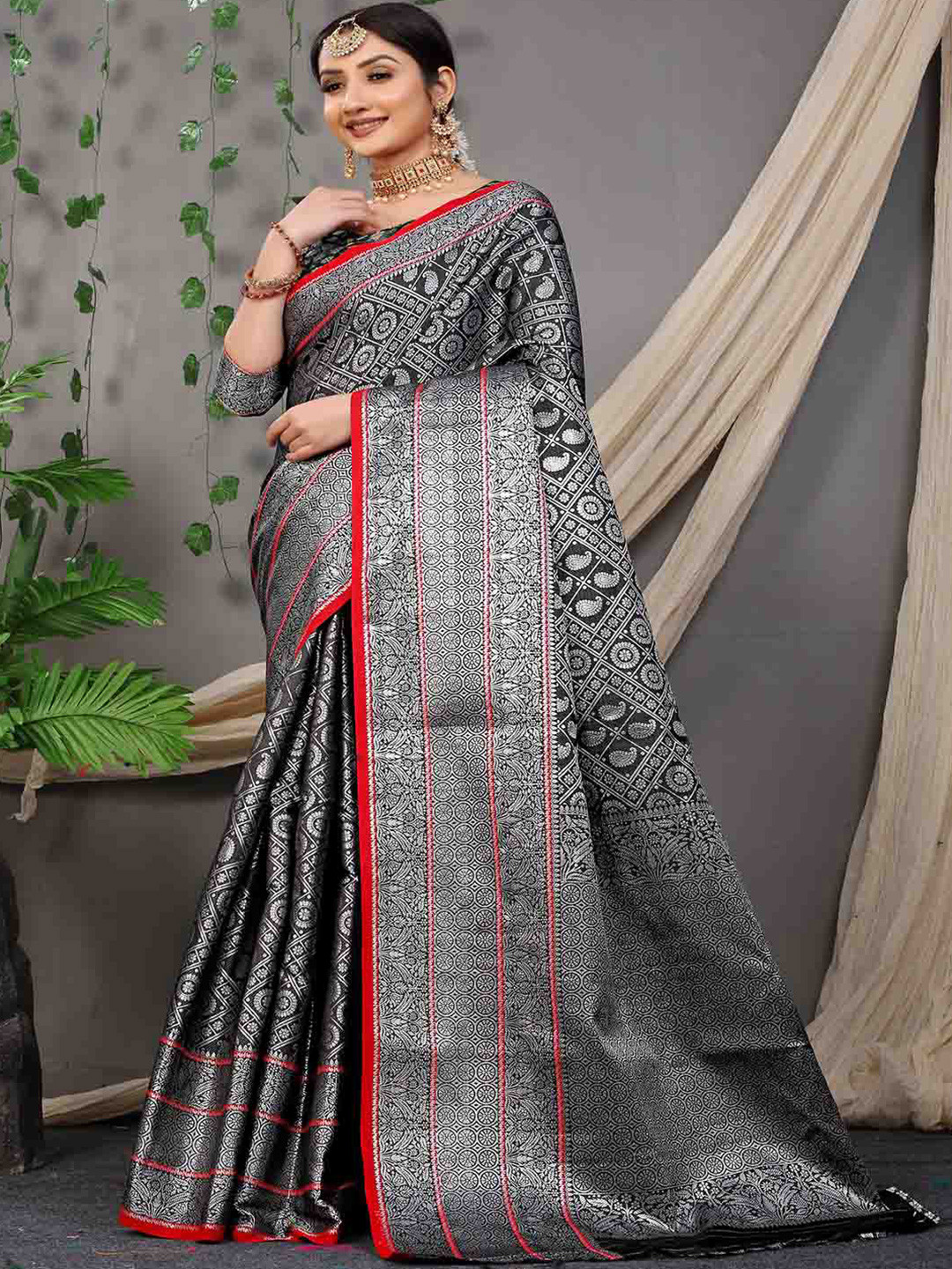 

Mitera Black & Red Ethnic Motifs Woven Design Zari Art Silk Saree