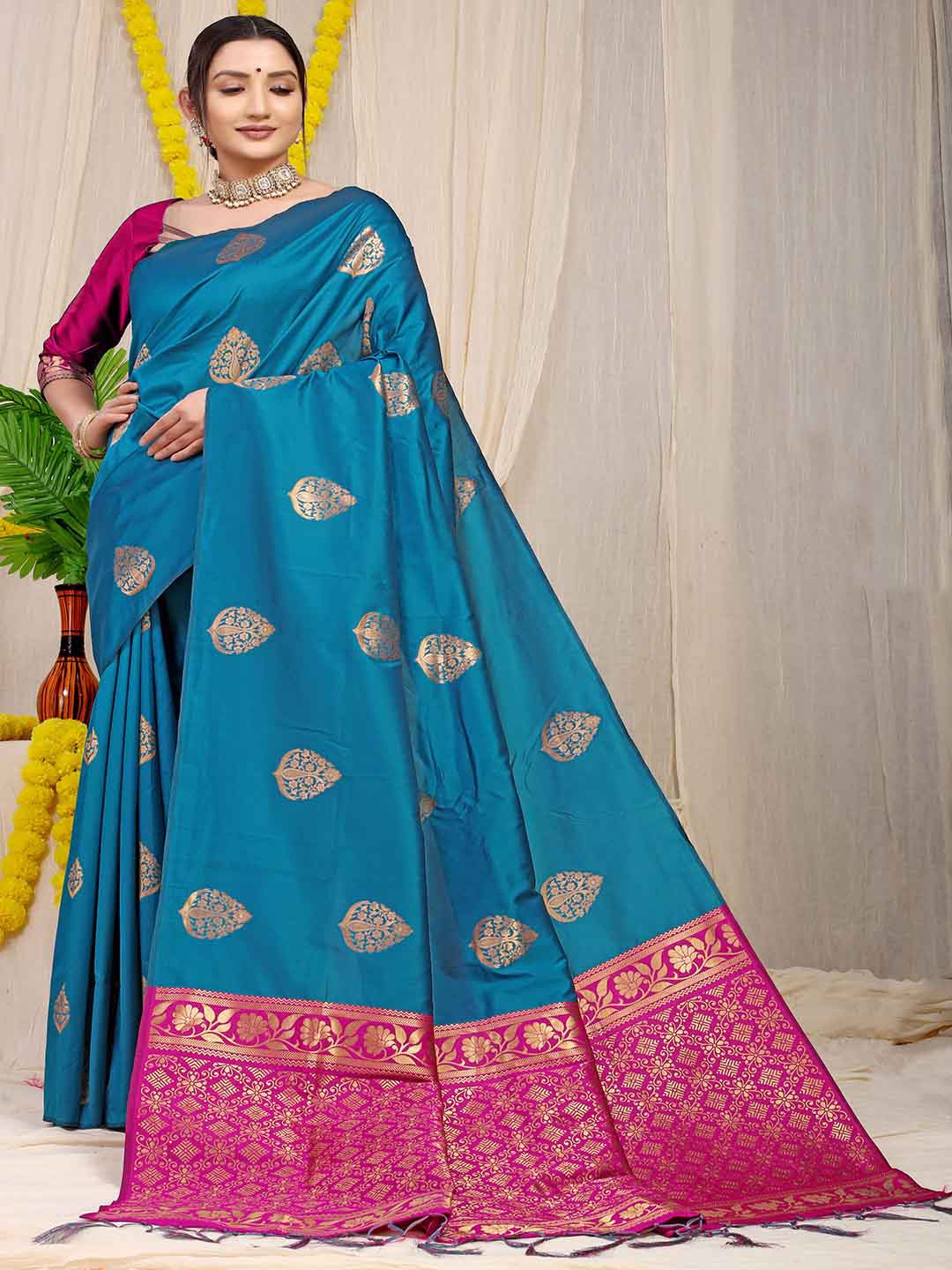 

Mitera Blue & Fuchsia Ethnic Motifs Woven Design Zari Saree