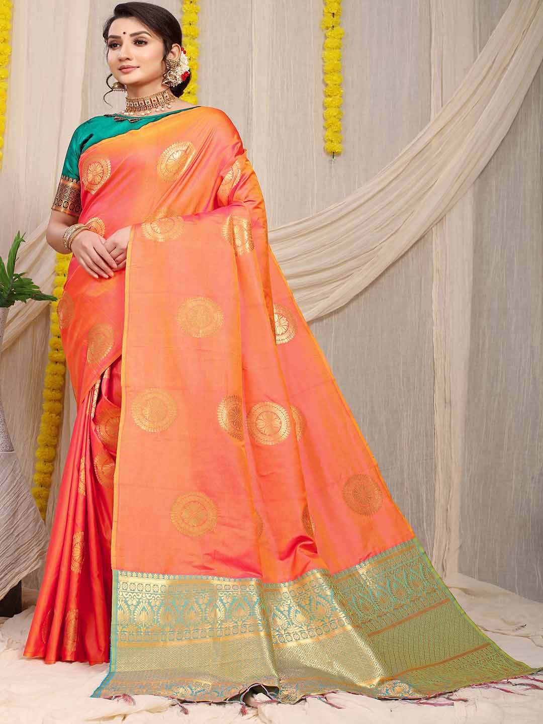 

Mitera Peach-Coloured and Green Ethnic Motifs Woven Design Zari Saree
