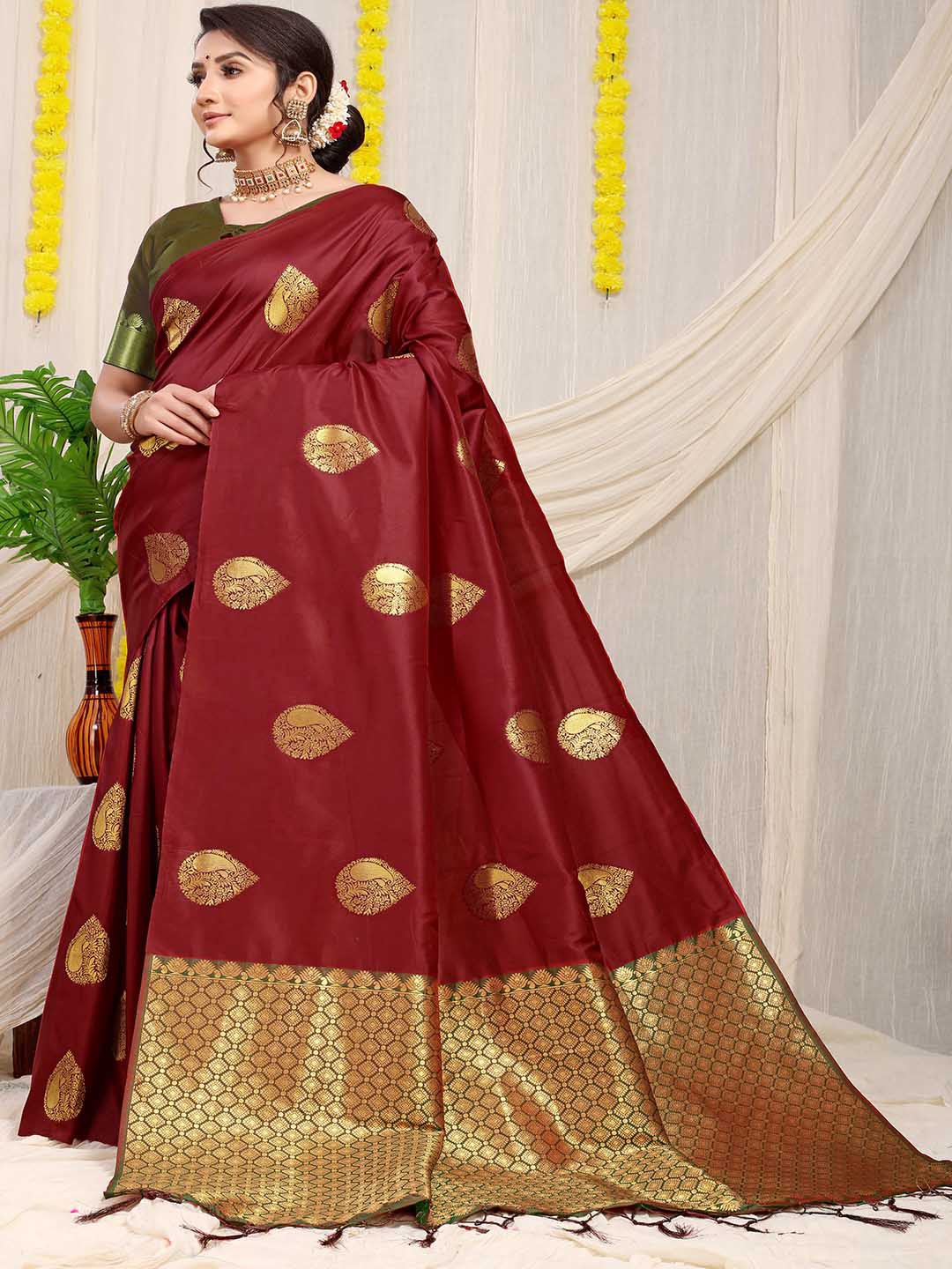 

Mitera Maroon & Olive Green Ethnic Motifs Woven Design Zari Saree