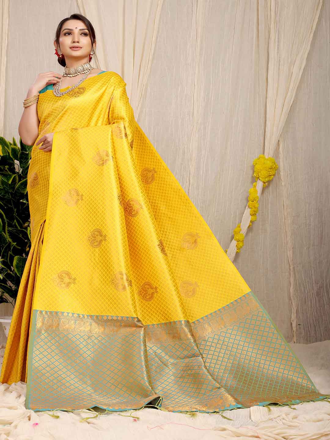 

Mitera Yellow & Green Ethnic Motifs Woven Design Zari Saree