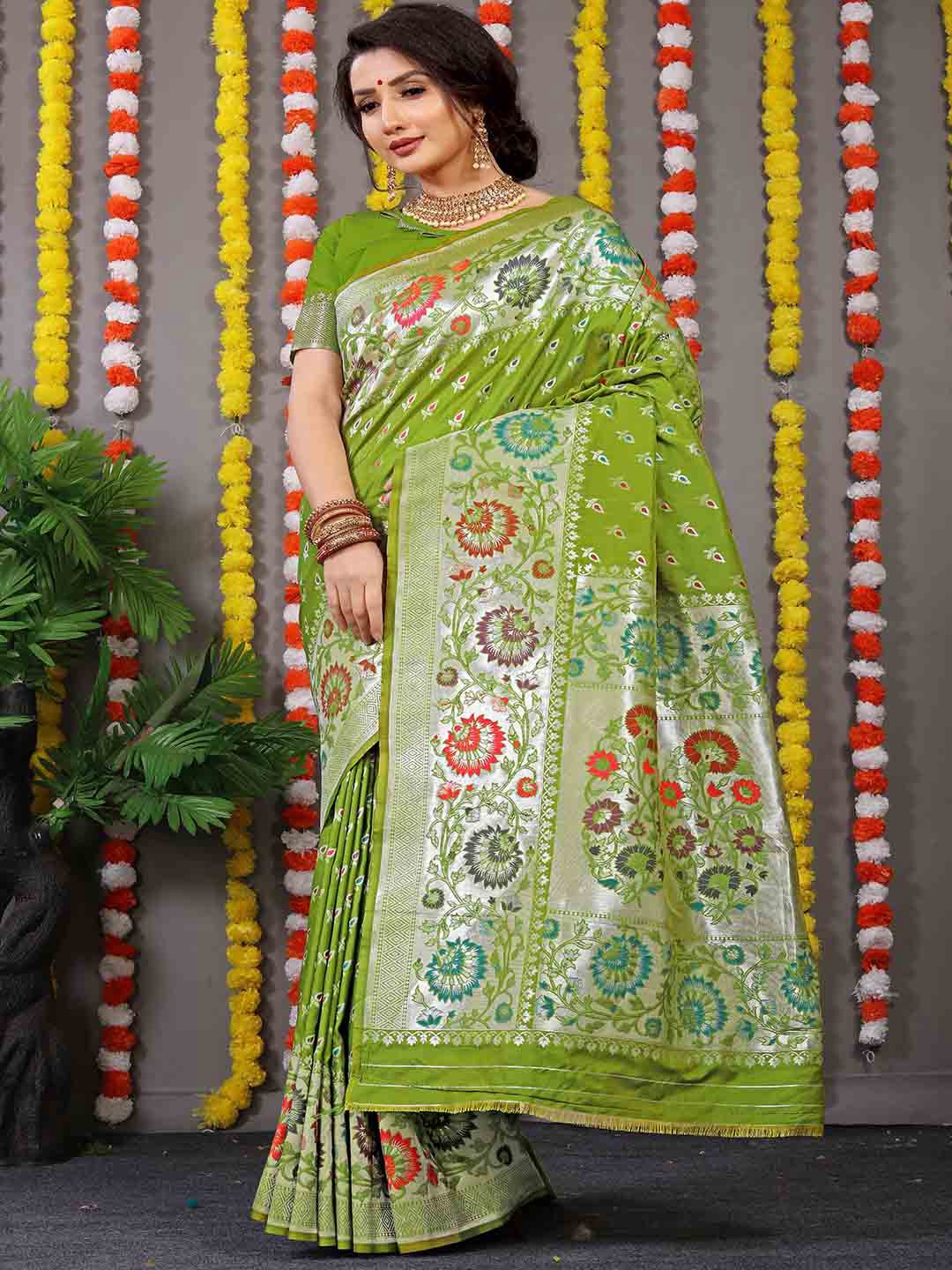 

Mitera Green and Silver-Toned Ethnic Motifs Woven Design Zari Saree