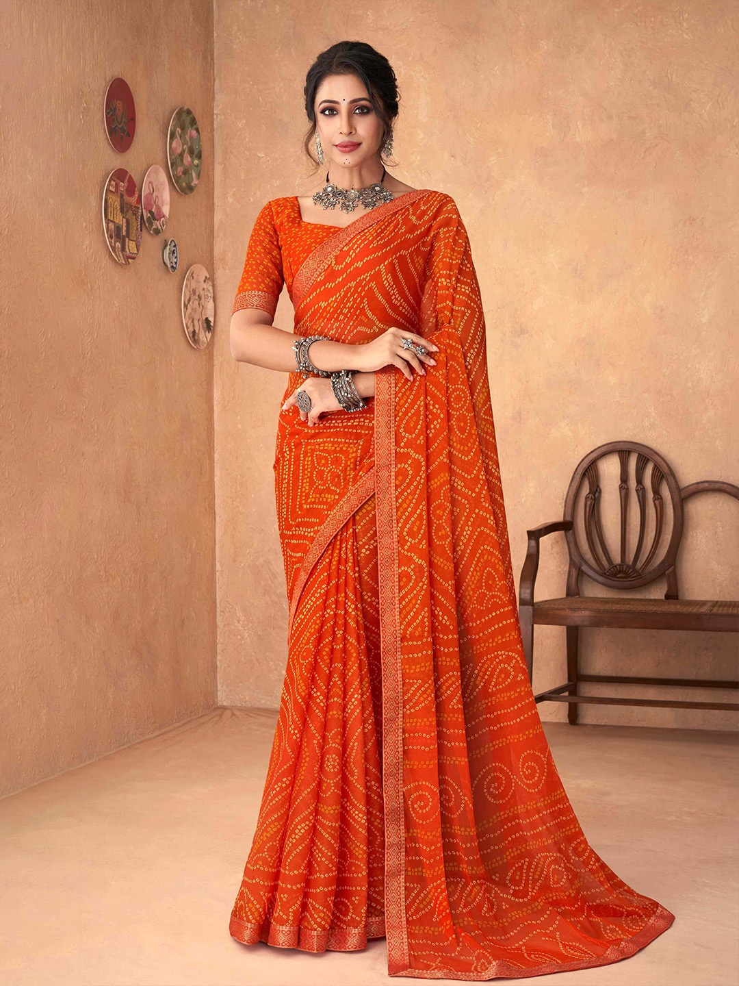 

Mitera Orange & Yellow Printed Bandhani Saree