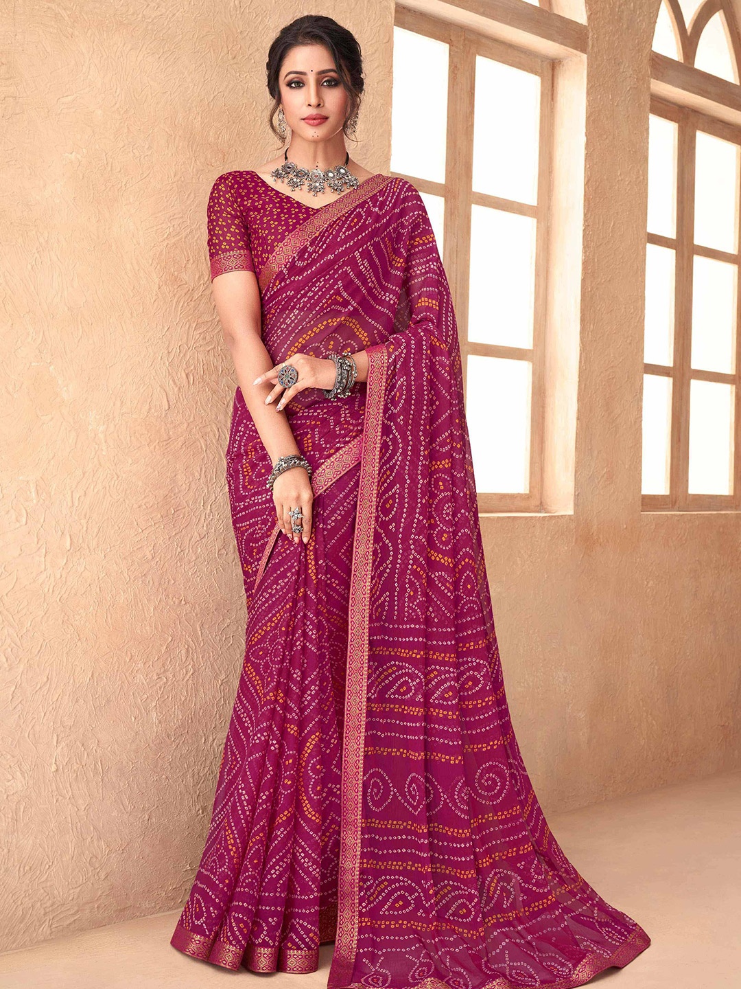 

Mitera Pink & Yellow Printed Zari Bandhani Saree