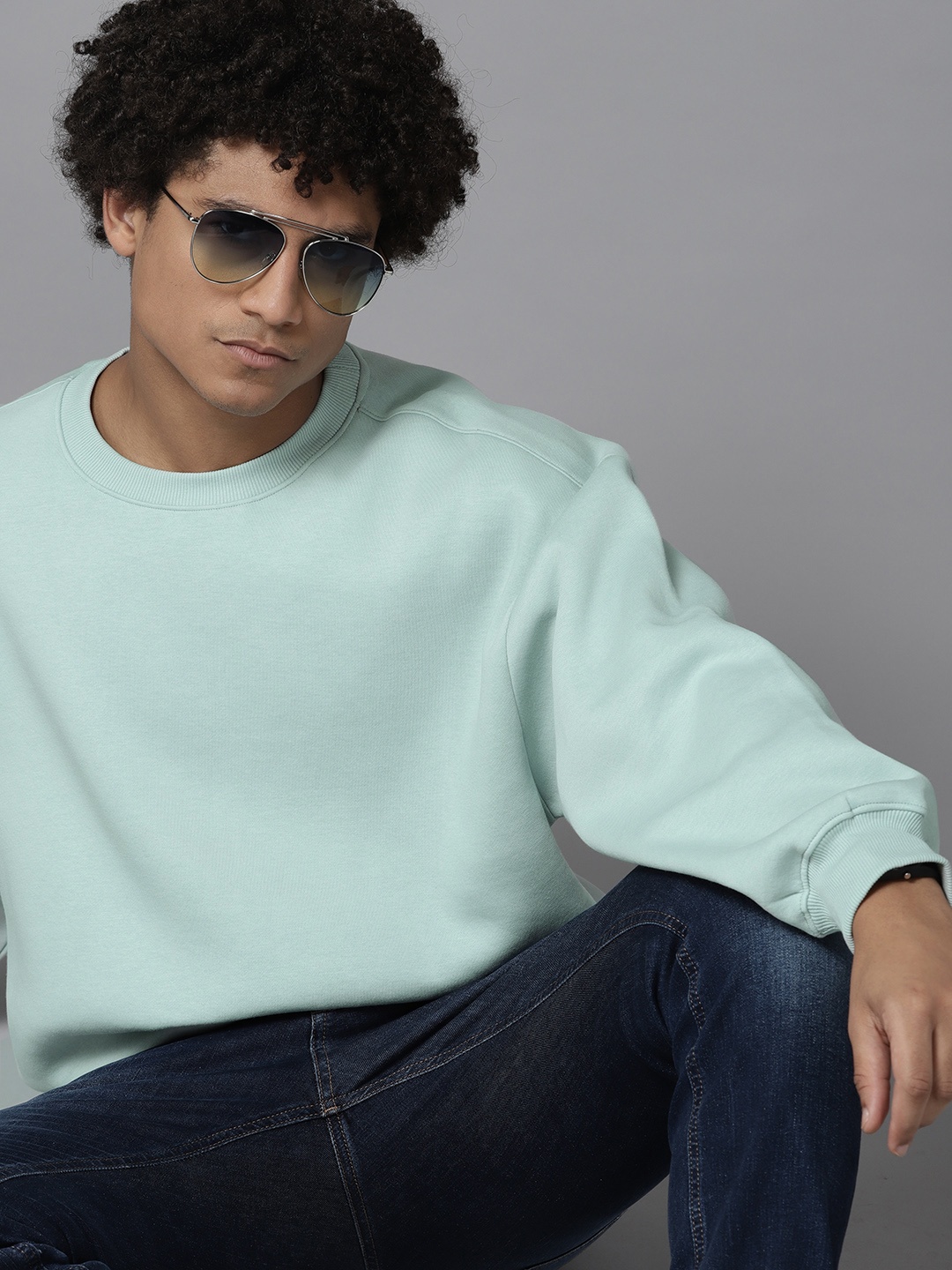 

Roadster Men Solid Pullover Sweatshirt, Sea green