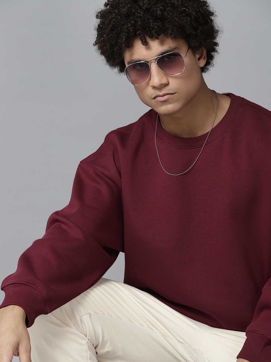 

Roadster Men Solid Pullover Sweatshirt, Maroon