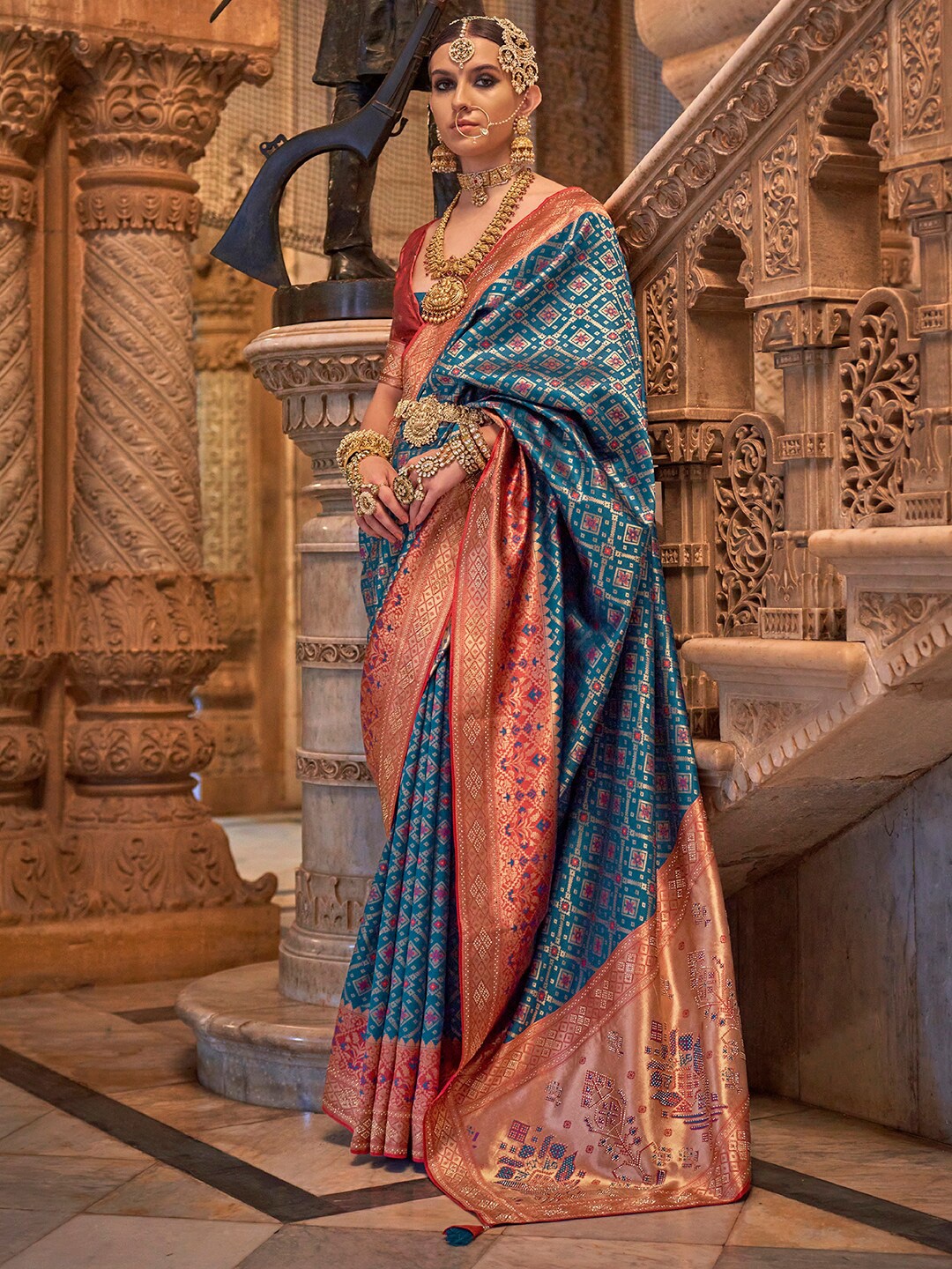 

Anouk Teal & Red Ethnic Motifs Beads and Stones Silk Blend Banarasi Saree