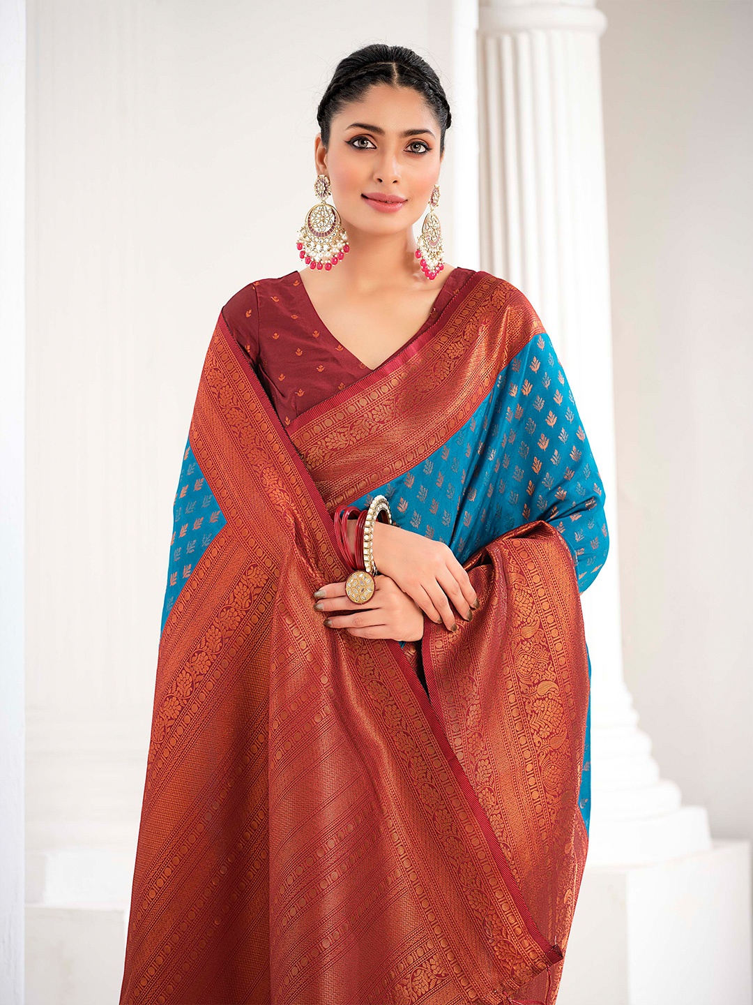 

Sangria Turquoise Blue & Maroon Ethnic Motifs Woven Design Zari Saree