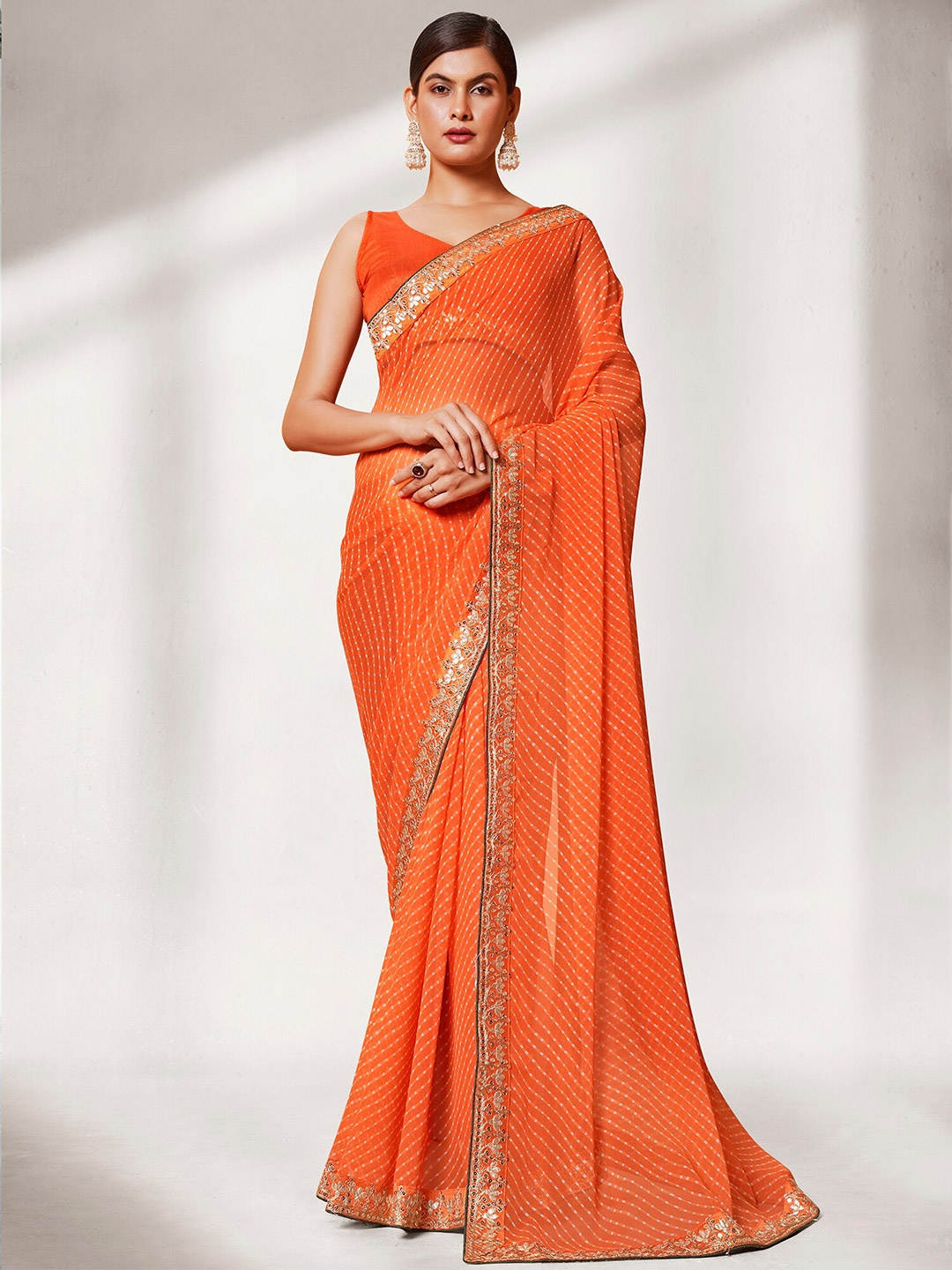 

Mitera Orange & White Leheriya Printed Pure Georgette Embroidered Saree