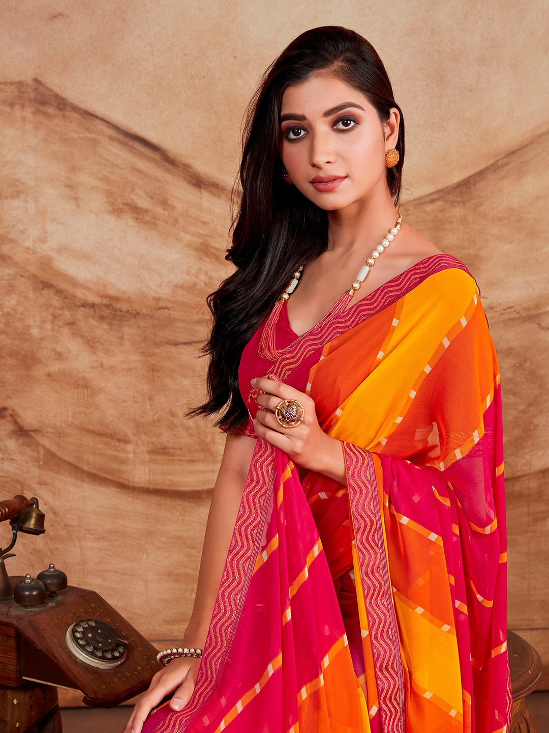 

Sangria Pink & Orange-Coloured Striped Poly Georgette Saree