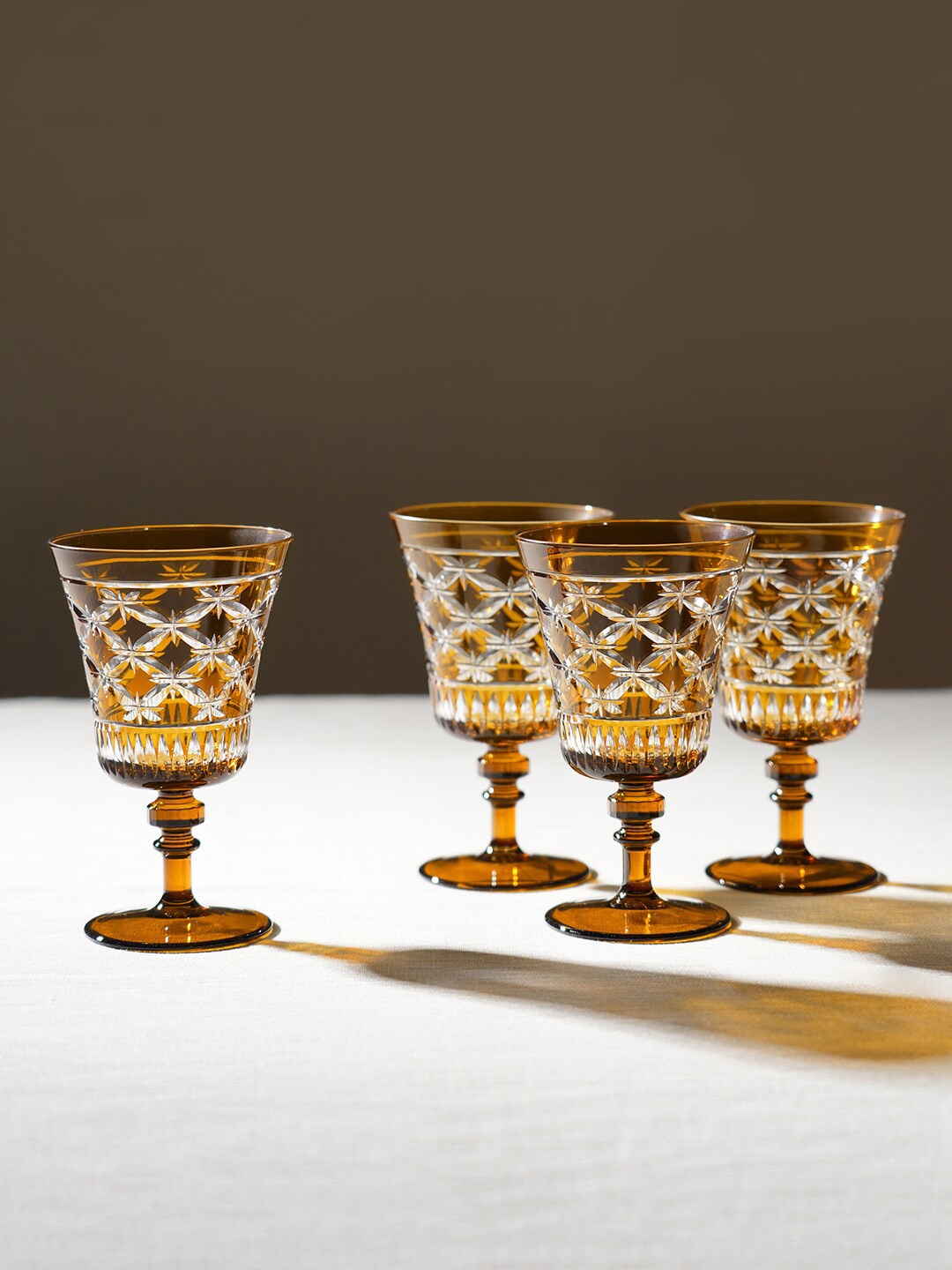 

Pure Home and Living Brown & Transparent 4 Pieces Diamond Cut Glass Wine Glass