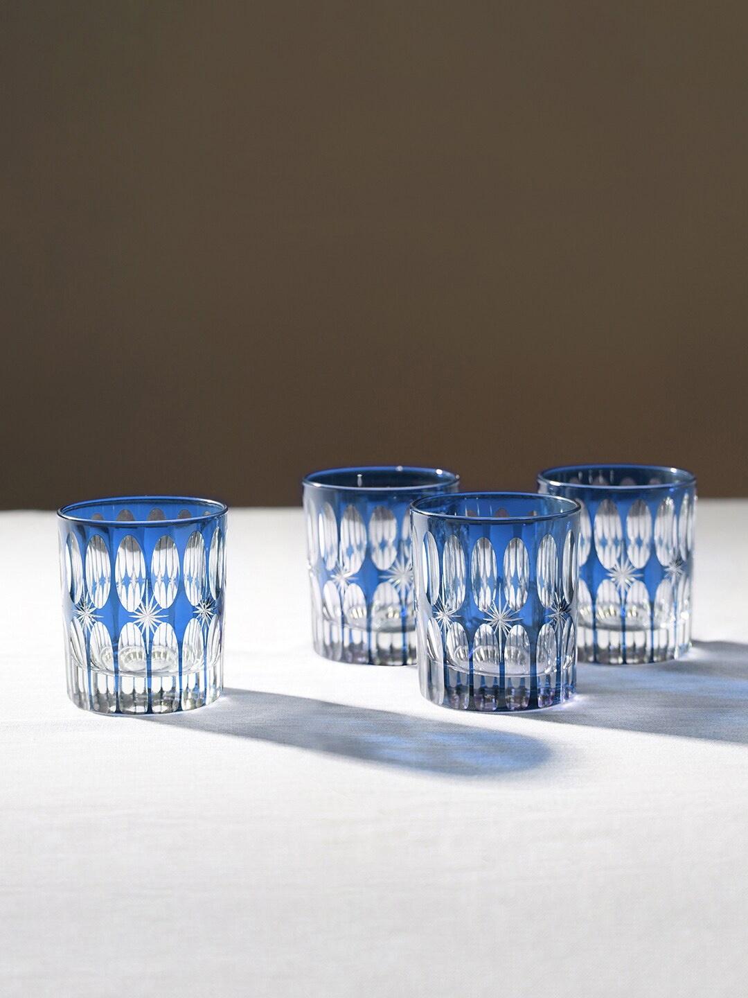 

Pure Home and Living Blue & Transparent 4 Pieces Star Cut Glass Drinking Glasses