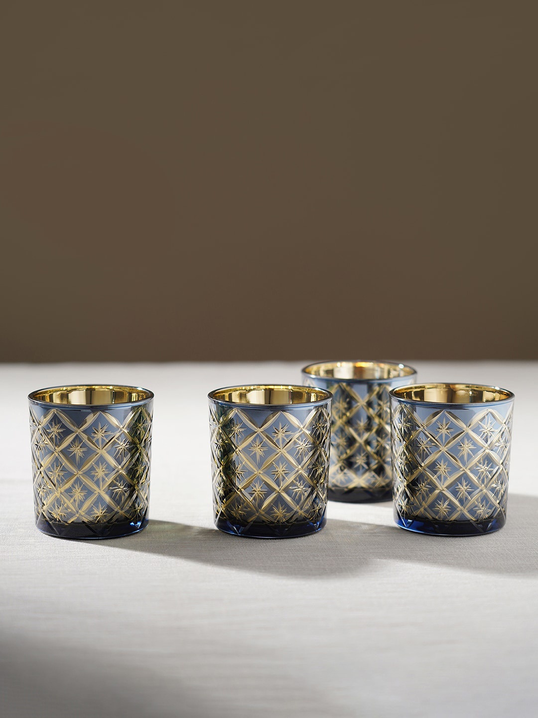 

Pure Home and Living Blue & White 4 Pieces Geometric Cut Patterned Glass Candle Holders