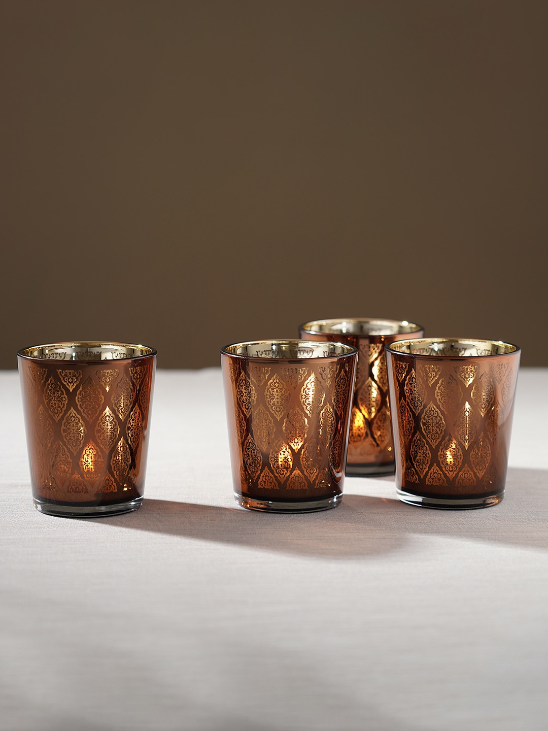 

Pure Home and Living Brown 4-Pieces Patterned Candle Holders