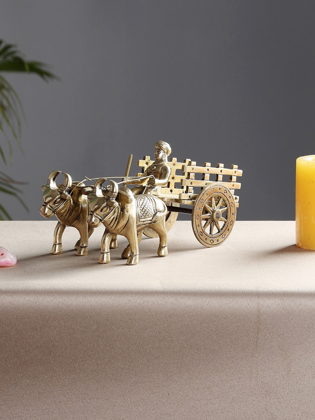 

Two Moustaches Yellow Textured Bullock Cart Figurine Showpiece