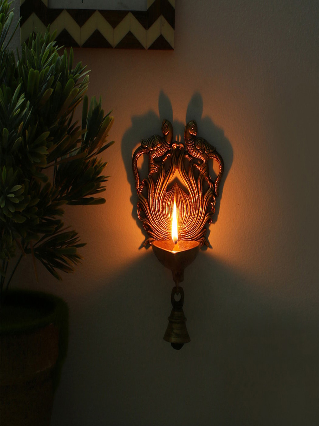 

Two Moustaches Peacock Design Wall Hanging Diya With Bell, Gold