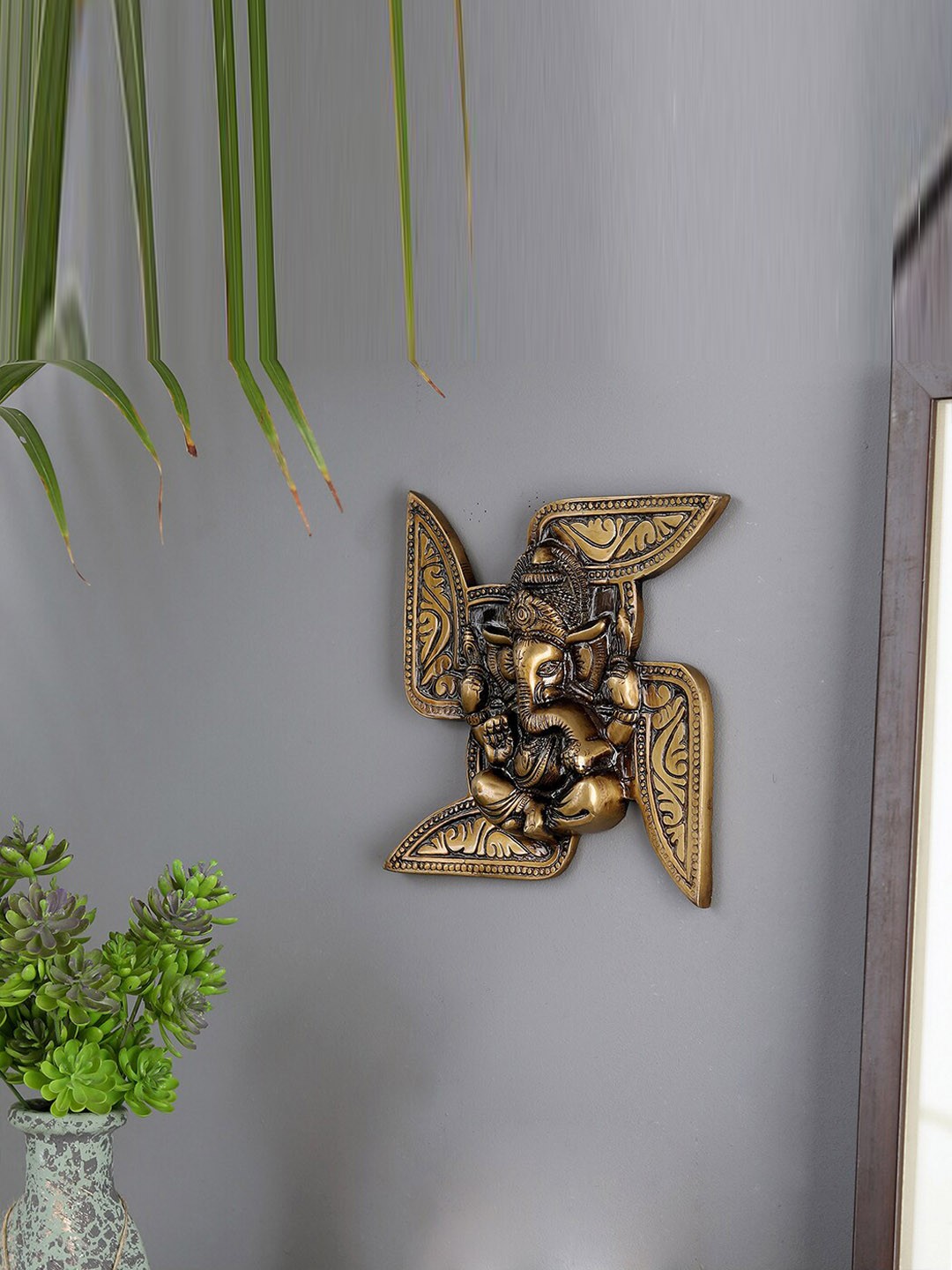 

Two Moustaches Yellow Textured Brass Ganesha Swastika Wall Hanging, Gold