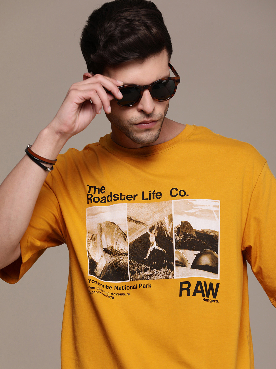 

The Roadster Lifestyle Co. Oversized Fit Pure Cotton Graphic Printed Drop-Shoulder Sleeves Casual T-shirt, Yellow