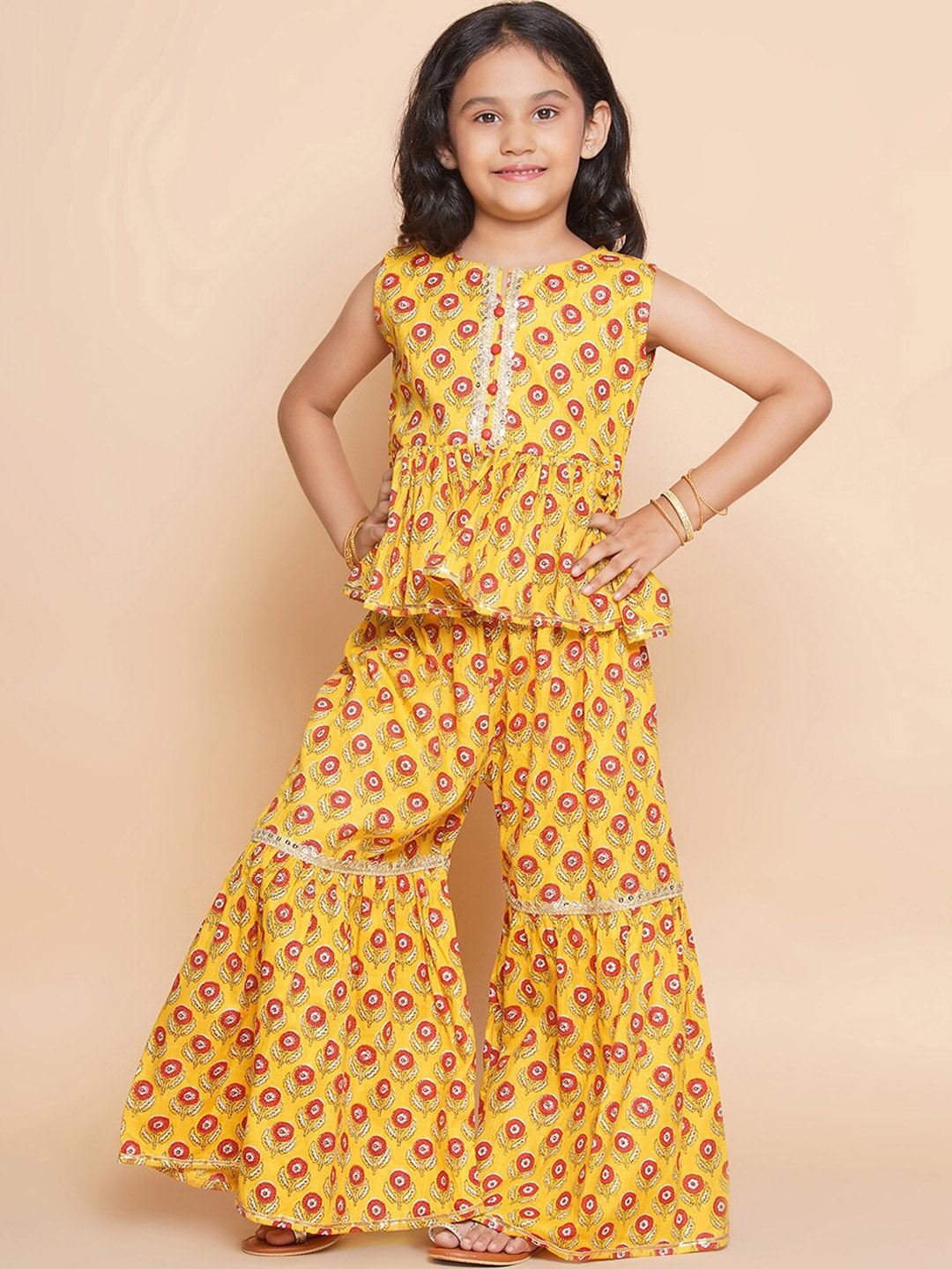 

Modish Couture Girls Floral Printed Round Neck Sleeveless Tunic & Sharara, Mustard