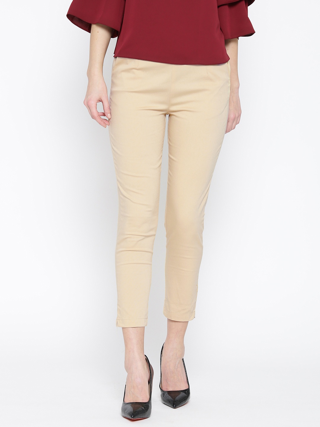 

Rangriti Women Beige Solid Cropped Trousers