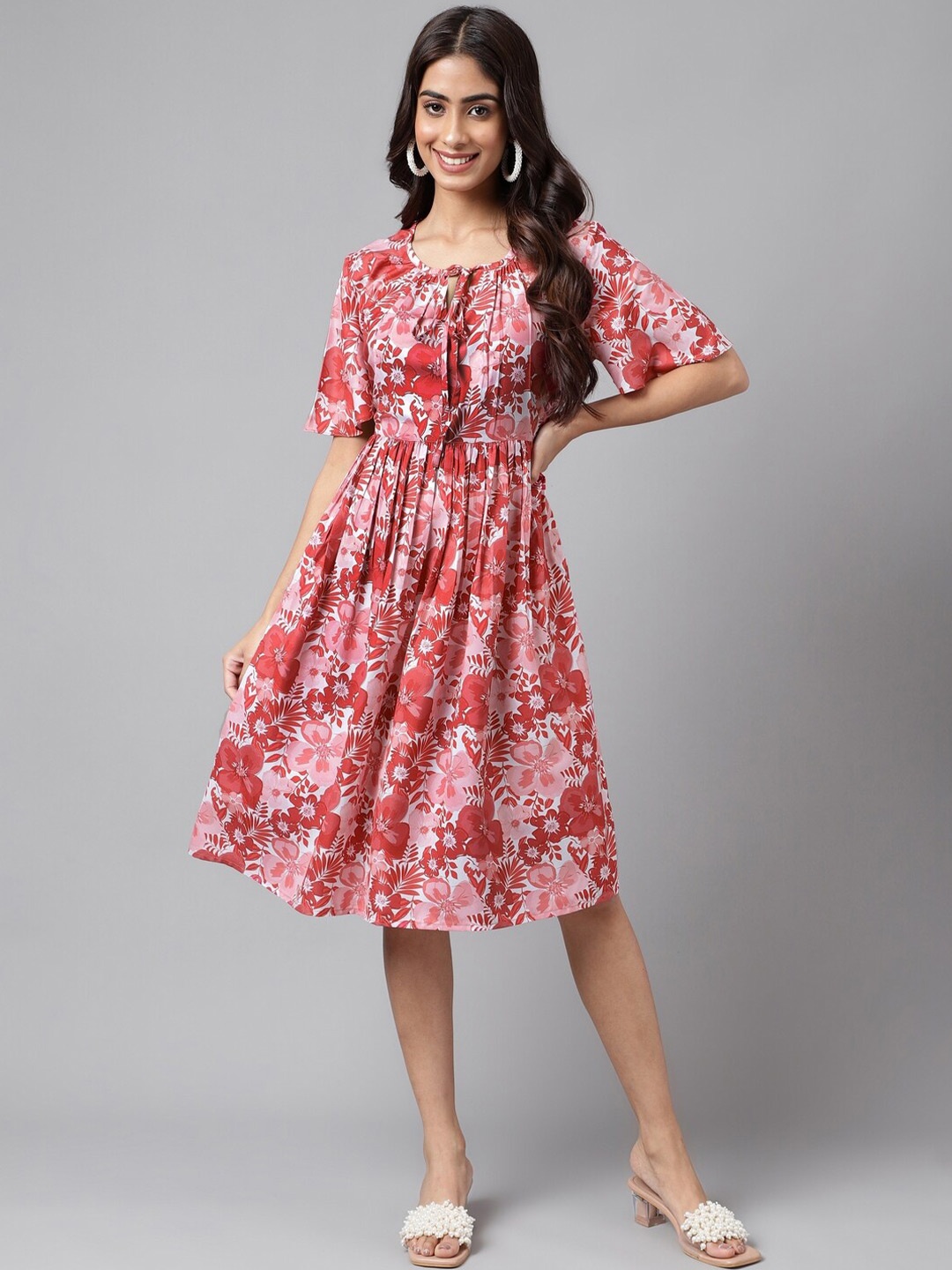 

Janasya Floral Printed Tie-Up Neck Flared Sleeves Fit & Flare Dress, Pink