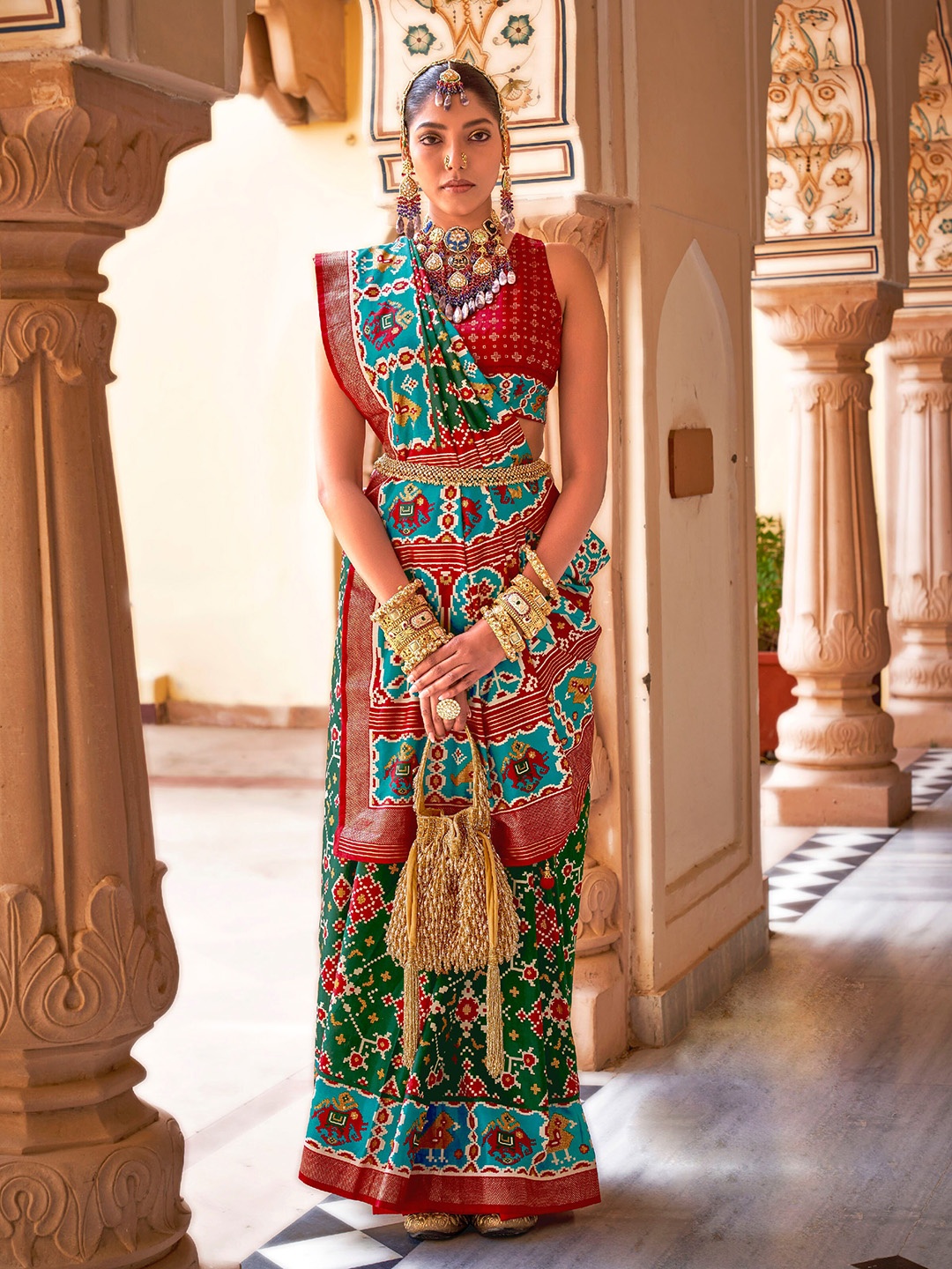 

Mitera Green & Maroon Ethnic Motifs Woven Design Zari Patola Saree