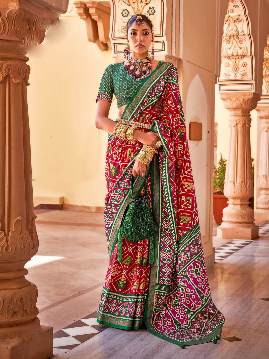 

Mitera Red & Green Ethnic Motifs Printed Zari Patola Saree