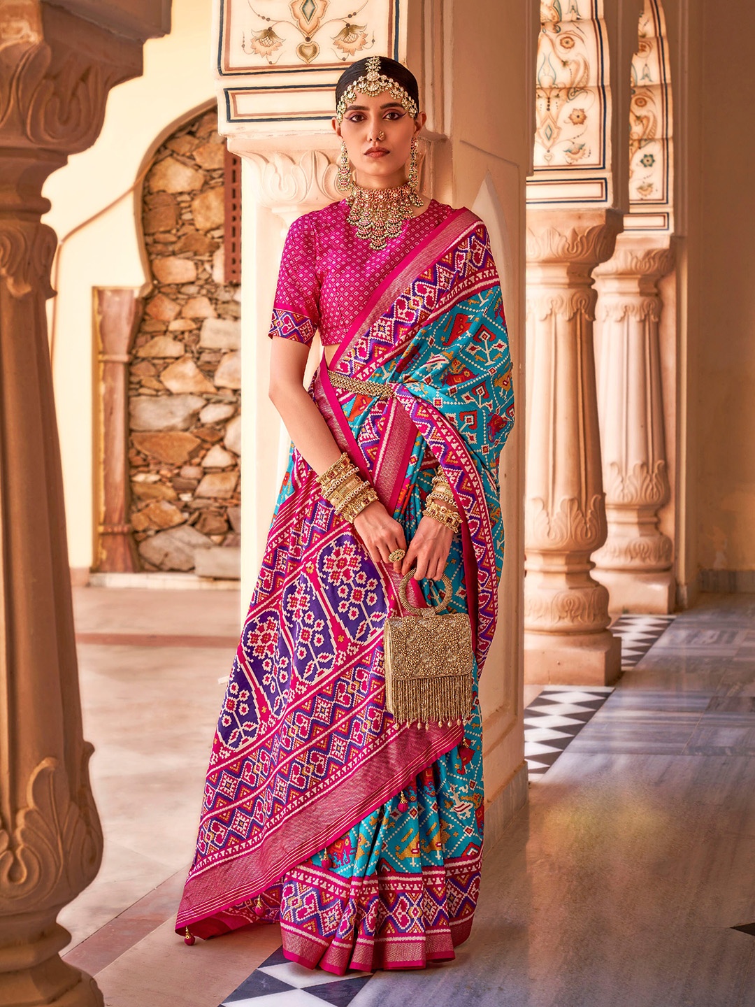 

Mitera Blue & Pink Ethnic Motifs Printed Zari Patola Saree