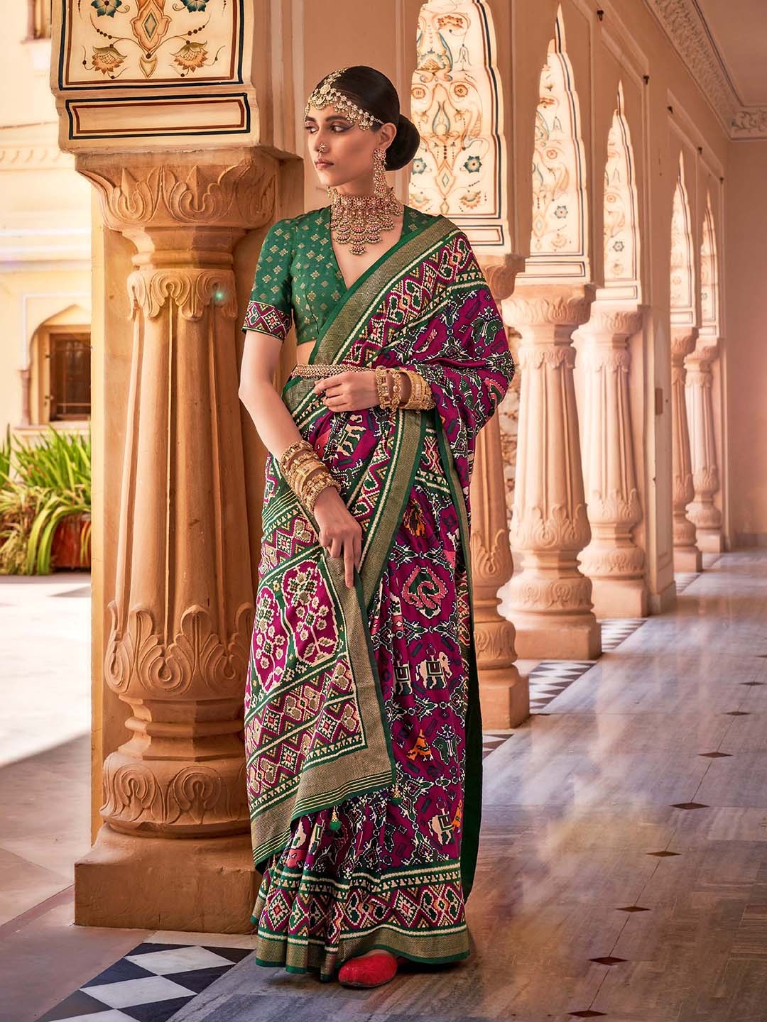 

Mitera Pink & Green Ethnic Motifs Printed Zari Detailed Saree