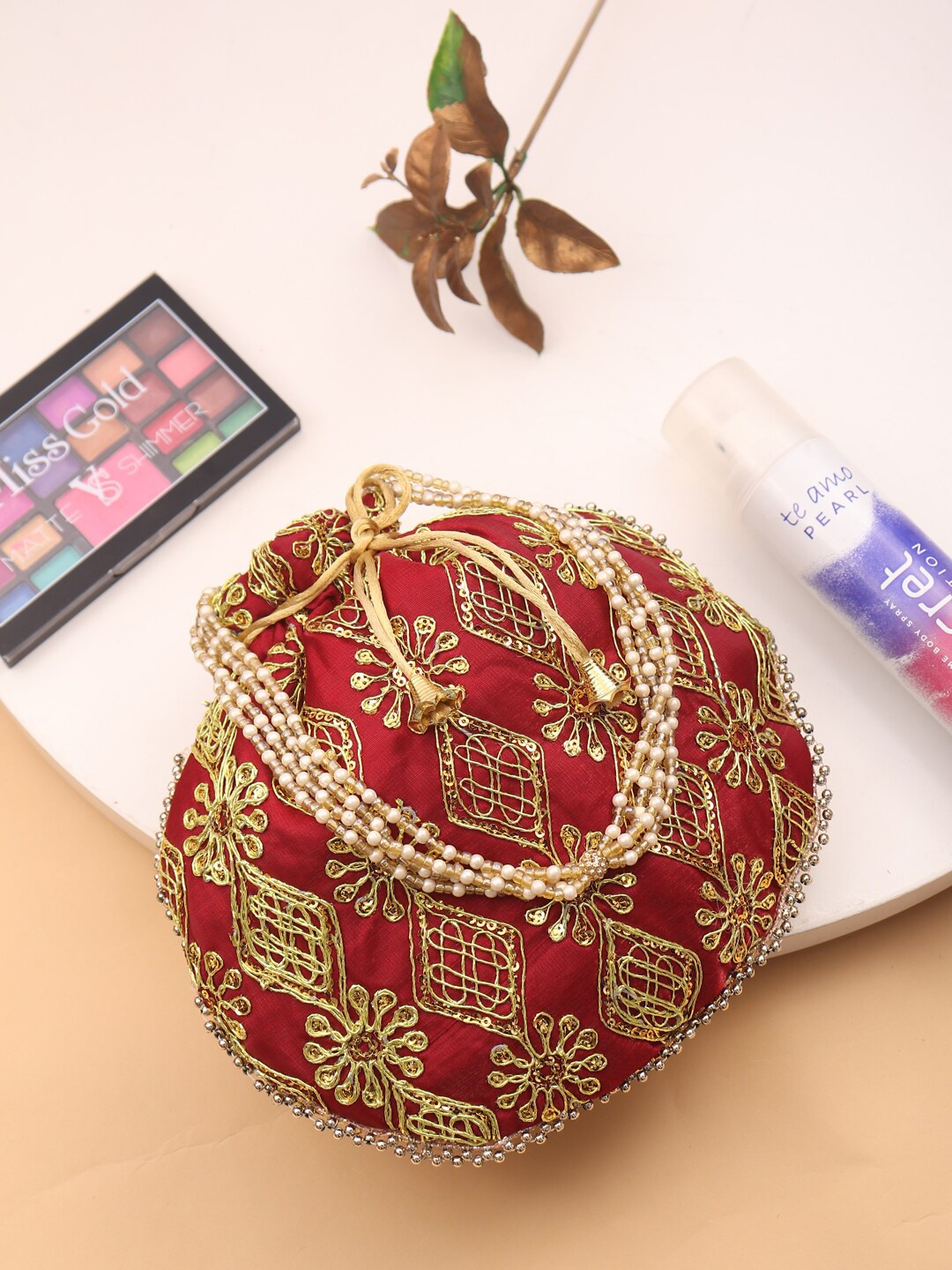 

LIKAA Maroon & Gold-Toned Embroidered Potli Clutch