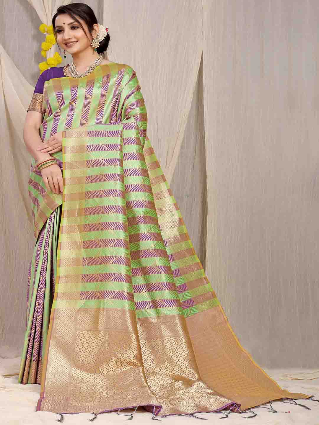 

Mitera Purple & Green Ethnic Motifs Woven Design Zari Saree