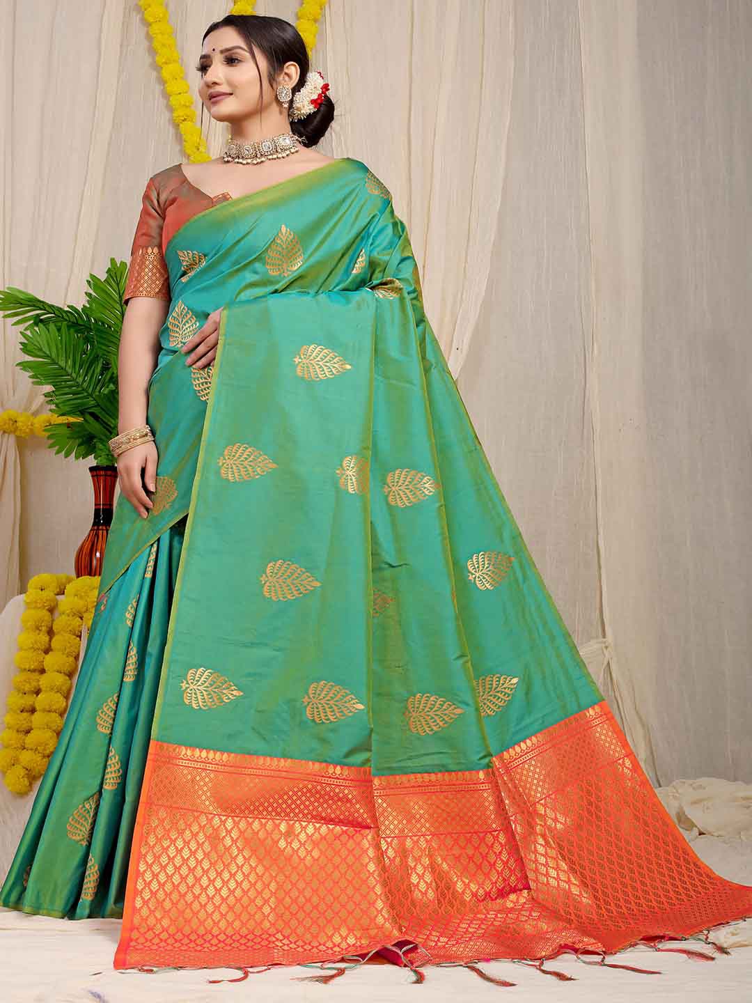 

Mitera Green & Orange Ethnic Motif Woven Design Zari Saree