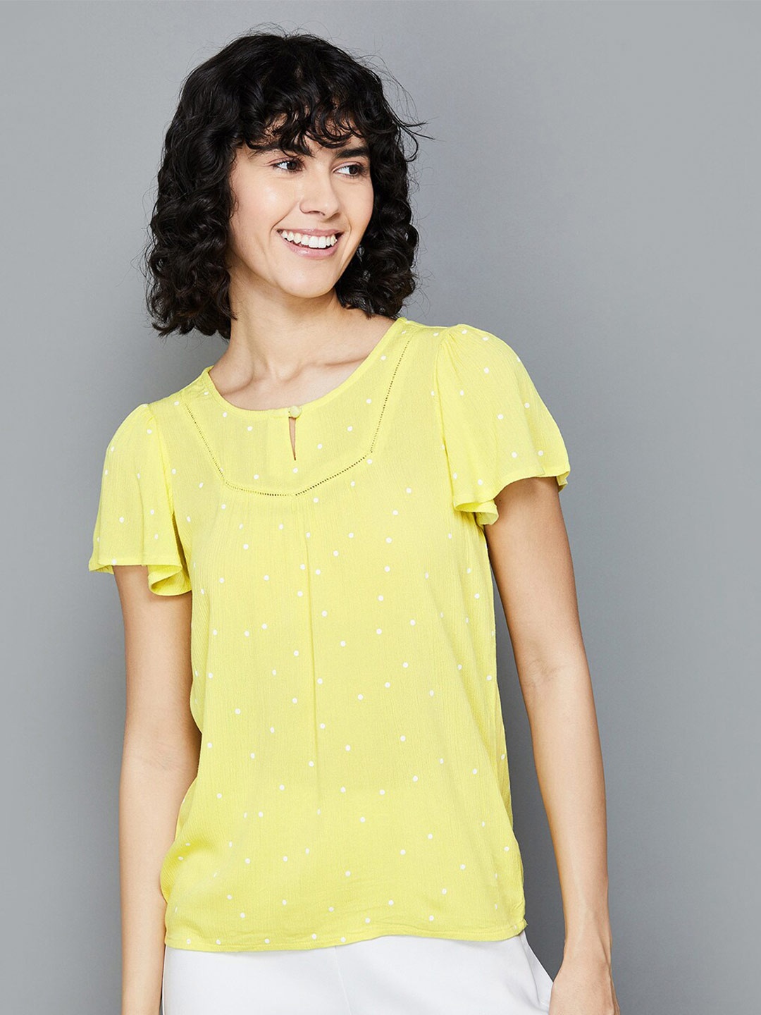 

Fame Forever by Lifestyle Polka Dot Printed Flutter Sleeves Lace Inserts Top, Yellow