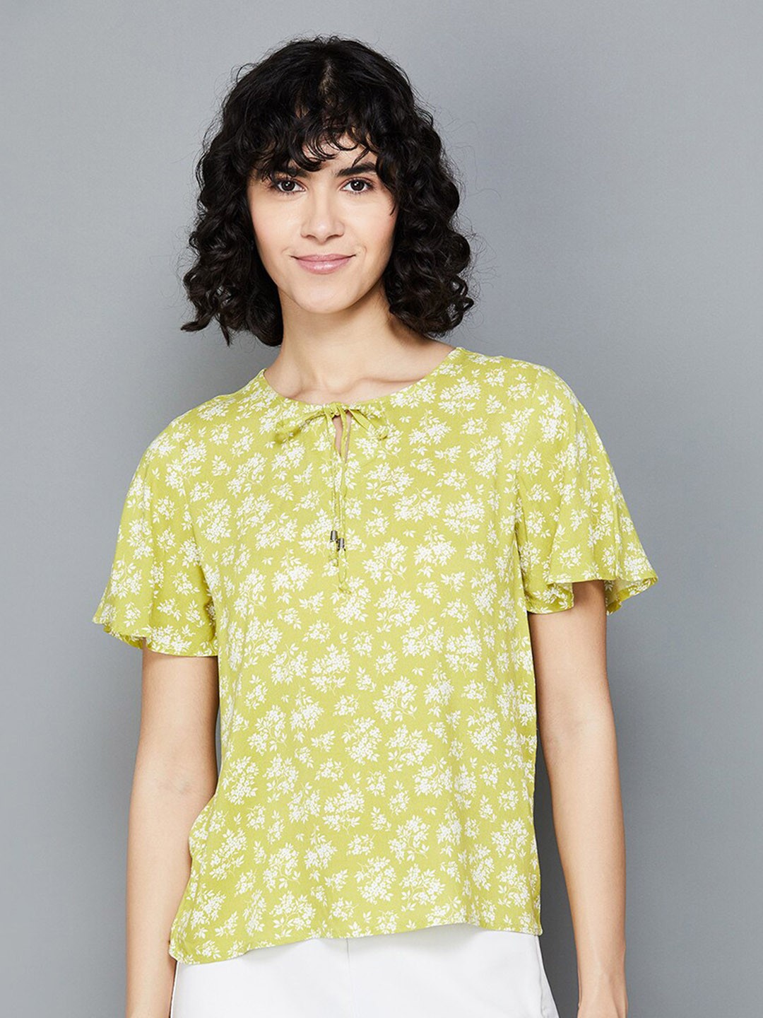 

Fame Forever by Lifestyle Floral Printed Tie Up Neck Flared Sleeves Top, Green