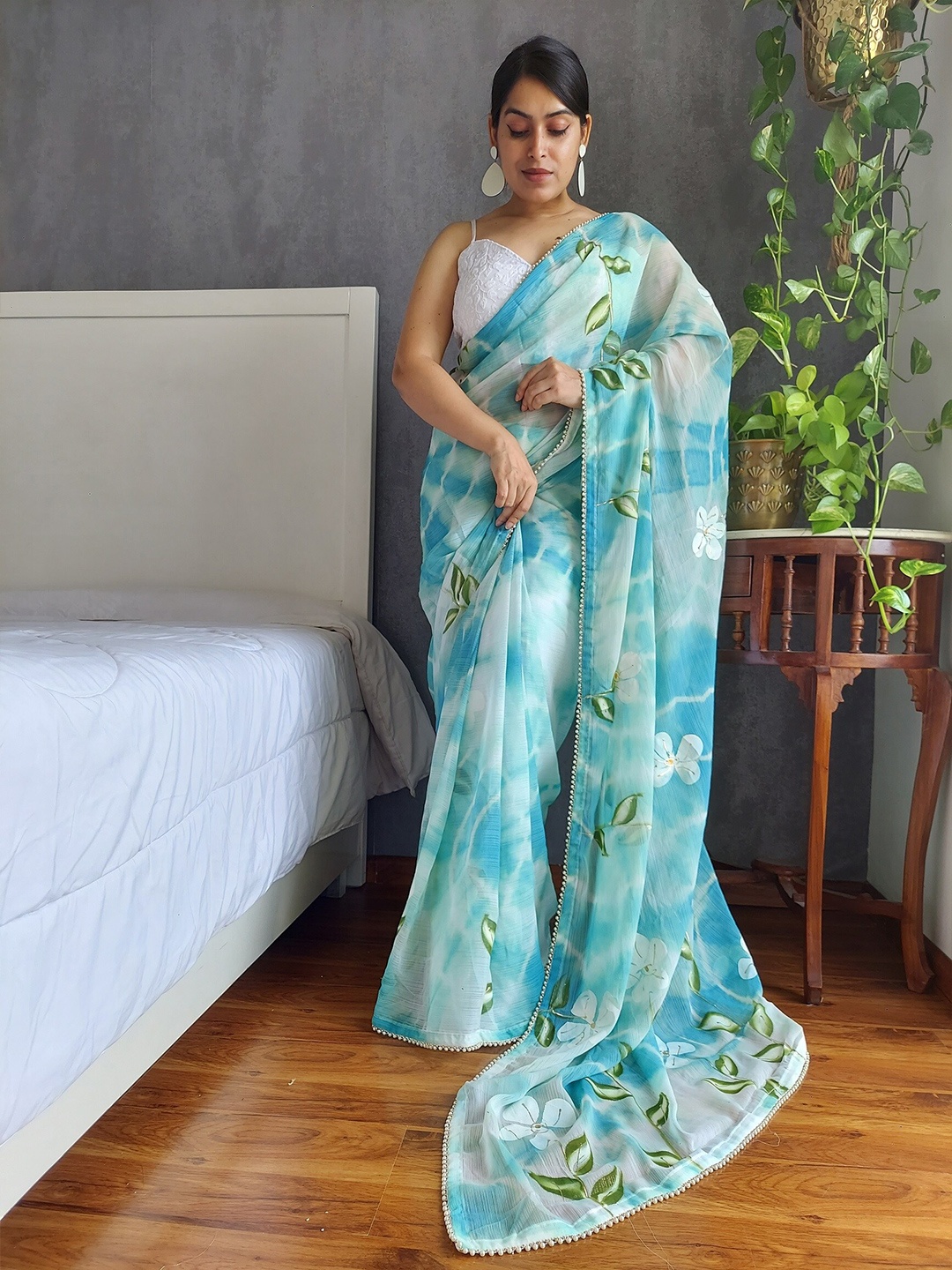 

Anouk Teal Floral Printed Beads and Stones Saree