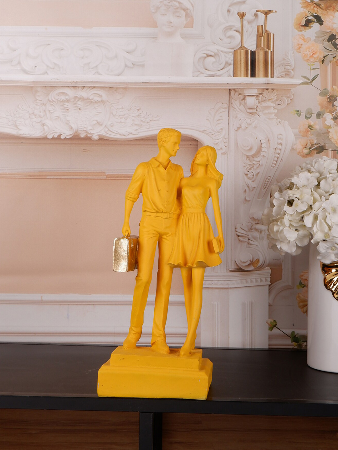 

THE WHITE INK DECOR Yellow & Gold-Toned Textured Couple With Bag Showpiece