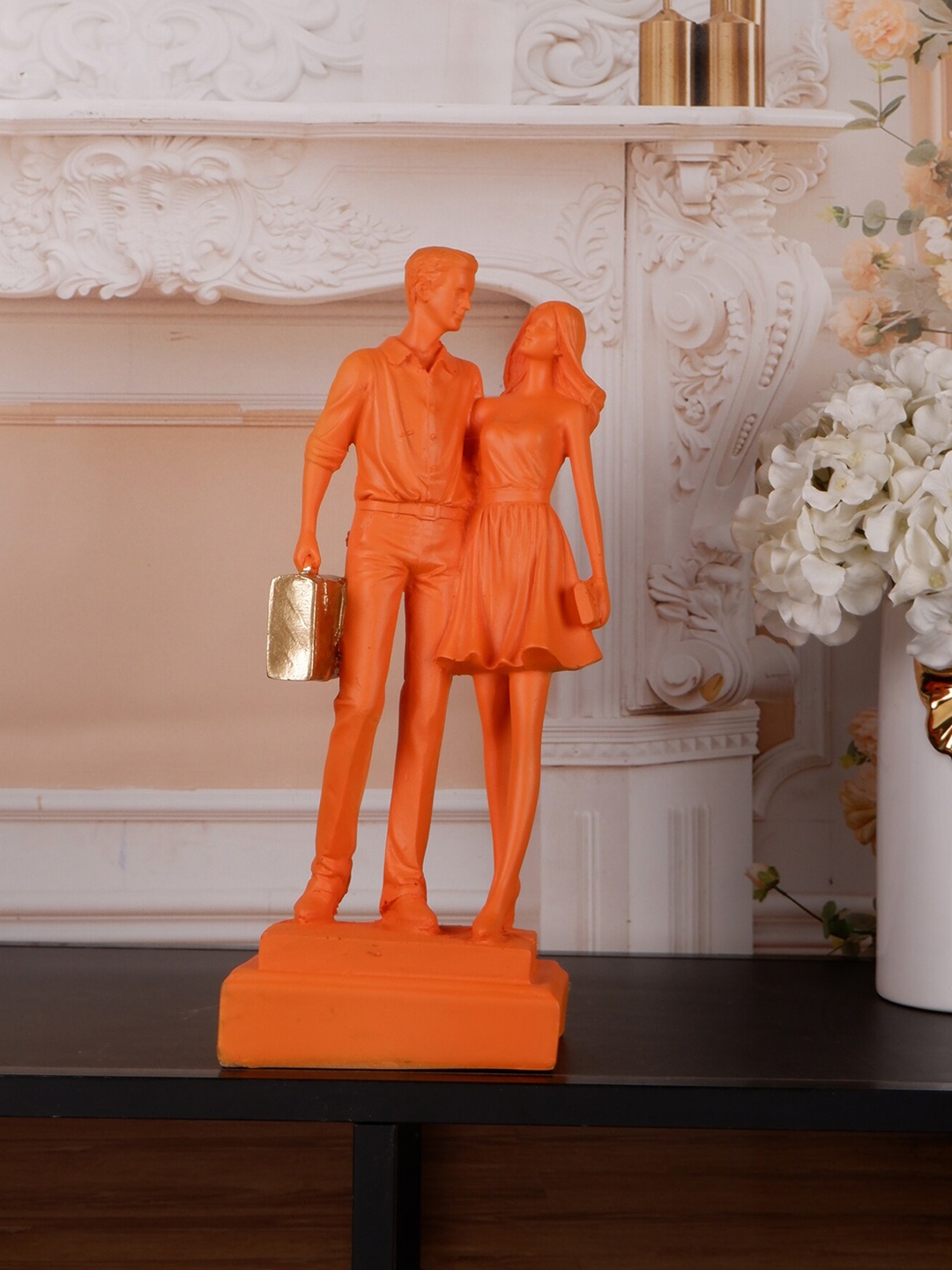 

THE WHITE INK DECOR Orange-color & Gold-Toned Textured Couple With Bag Showpiece