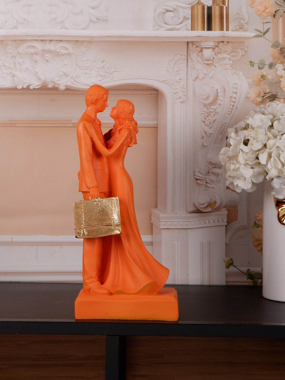 THE WHITE INK DECOR Orange & Gold-Toned Textured Couple With Bag Showpiece