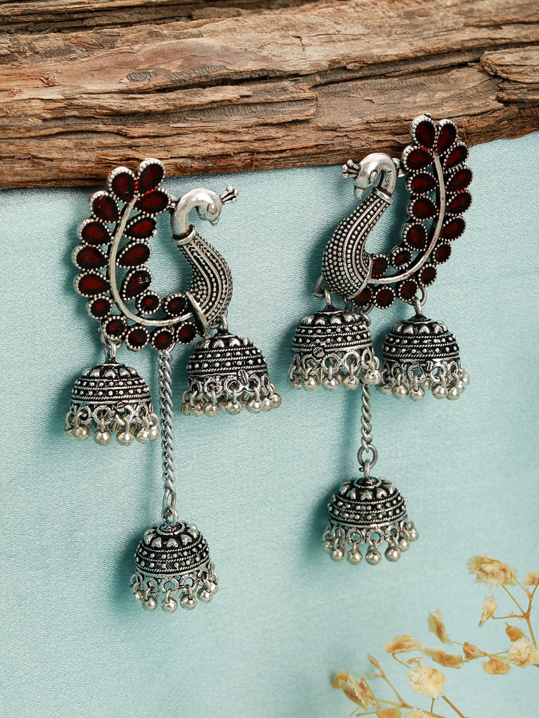 

Anouk Silver-Toned Peacock Shaped Oxidised Jhumkas Earrings