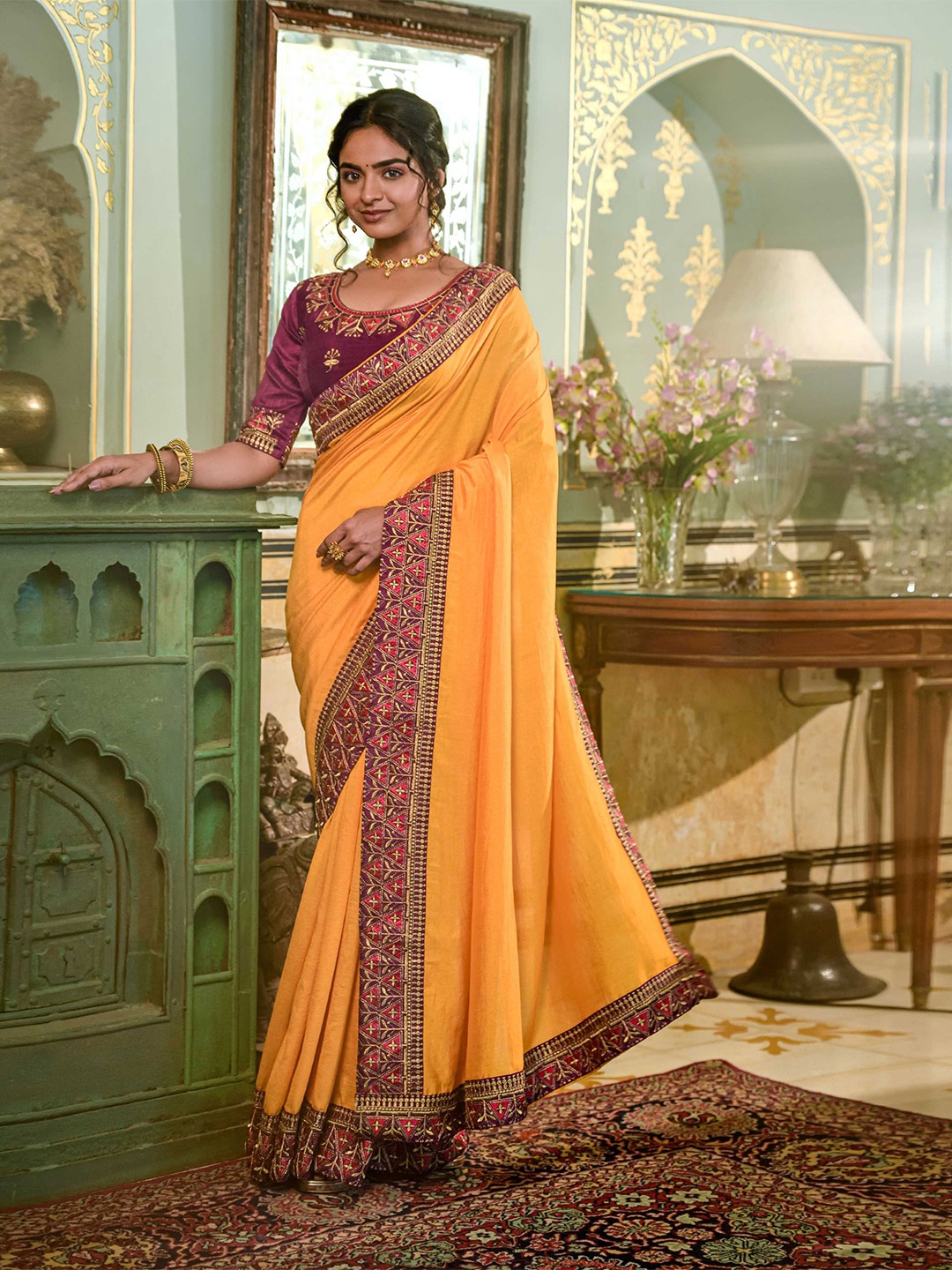

Mitera Yellow & Red Embroidered Saree