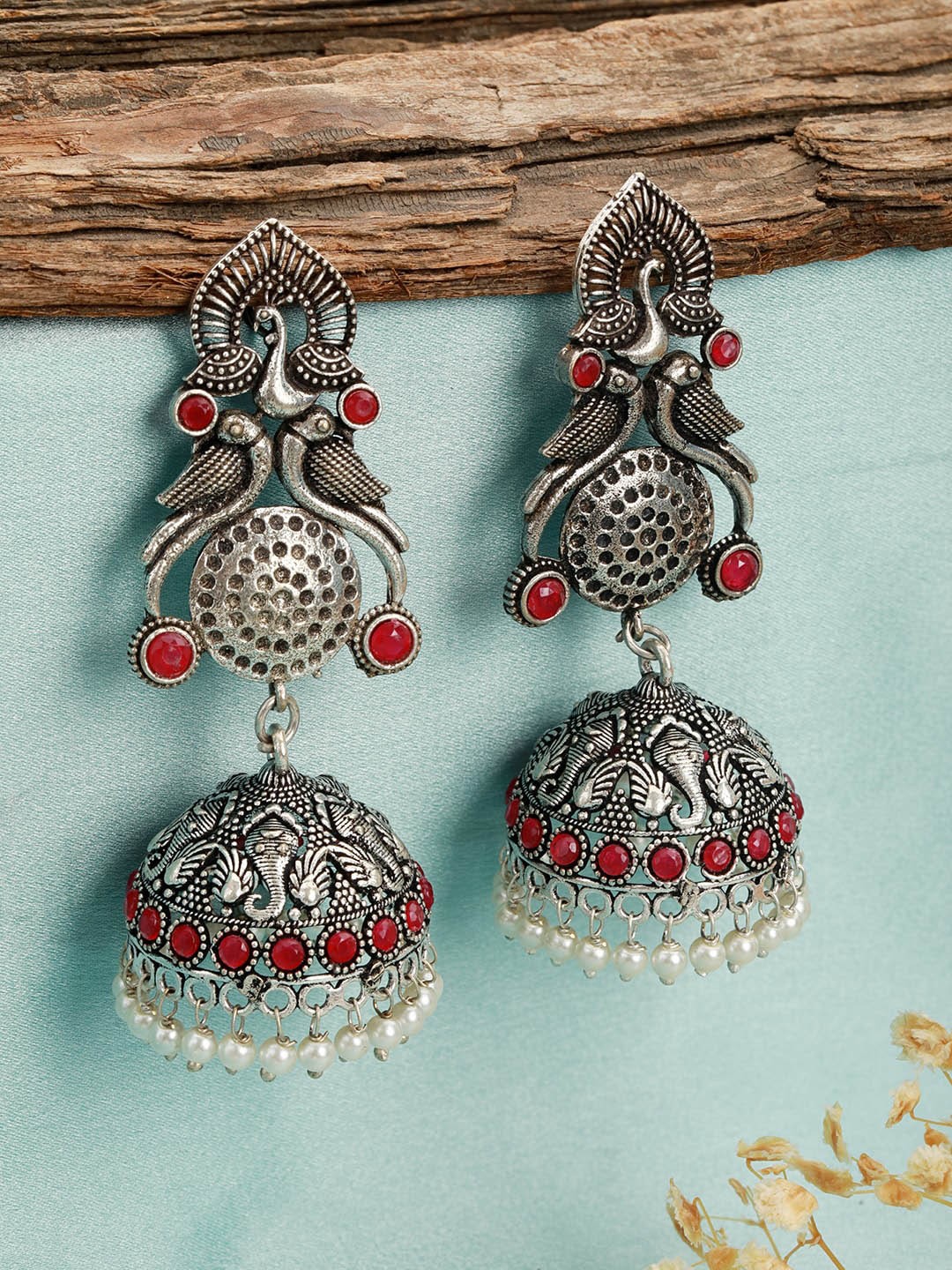 

Jazz and Sizzle Silver-Plated Peacock Shaped Jhumkas